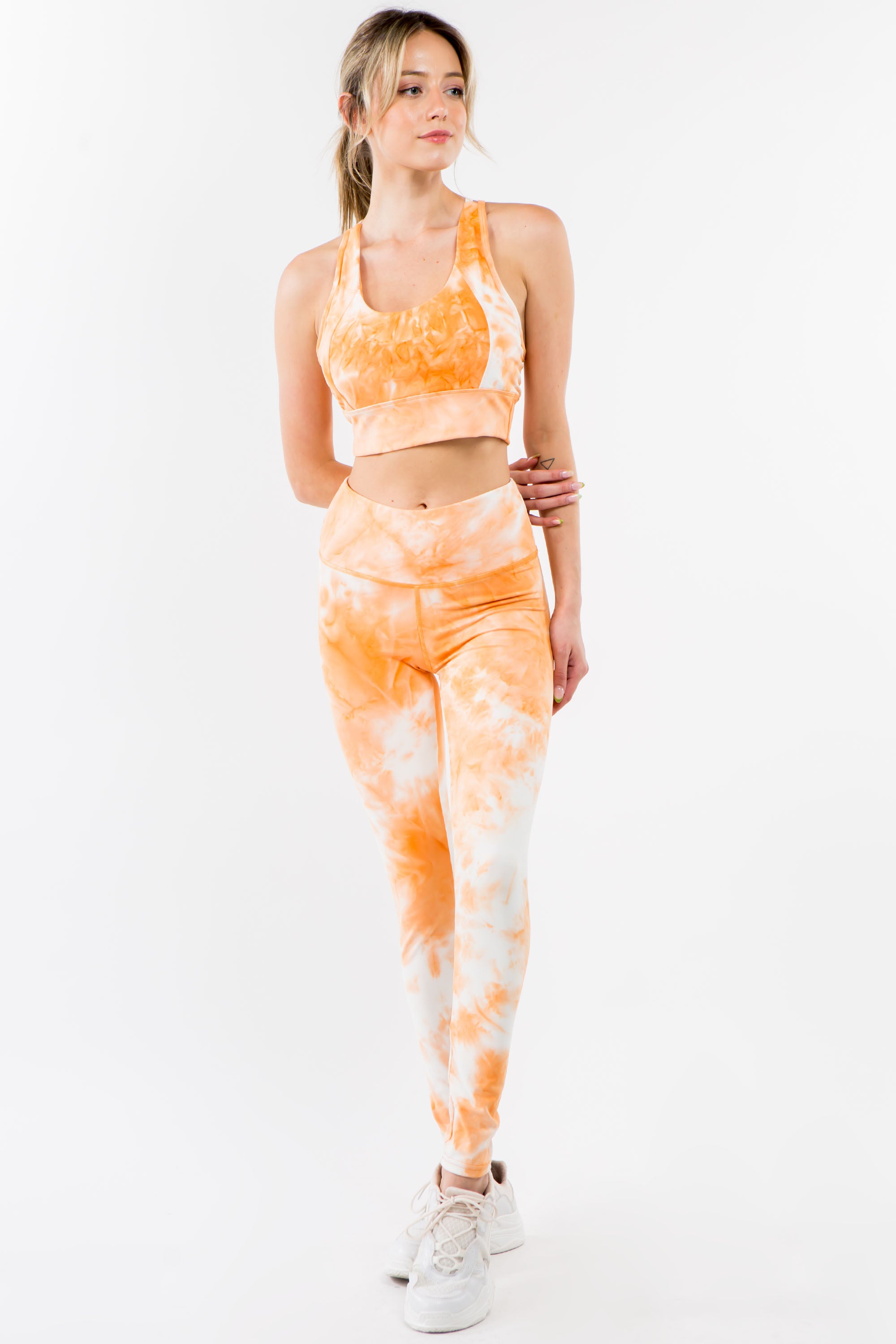 Tie-Dye Activewear Set in Orange Cream featuring a racerback bra and high-waisted leggings, perfect for workouts and casual wear.