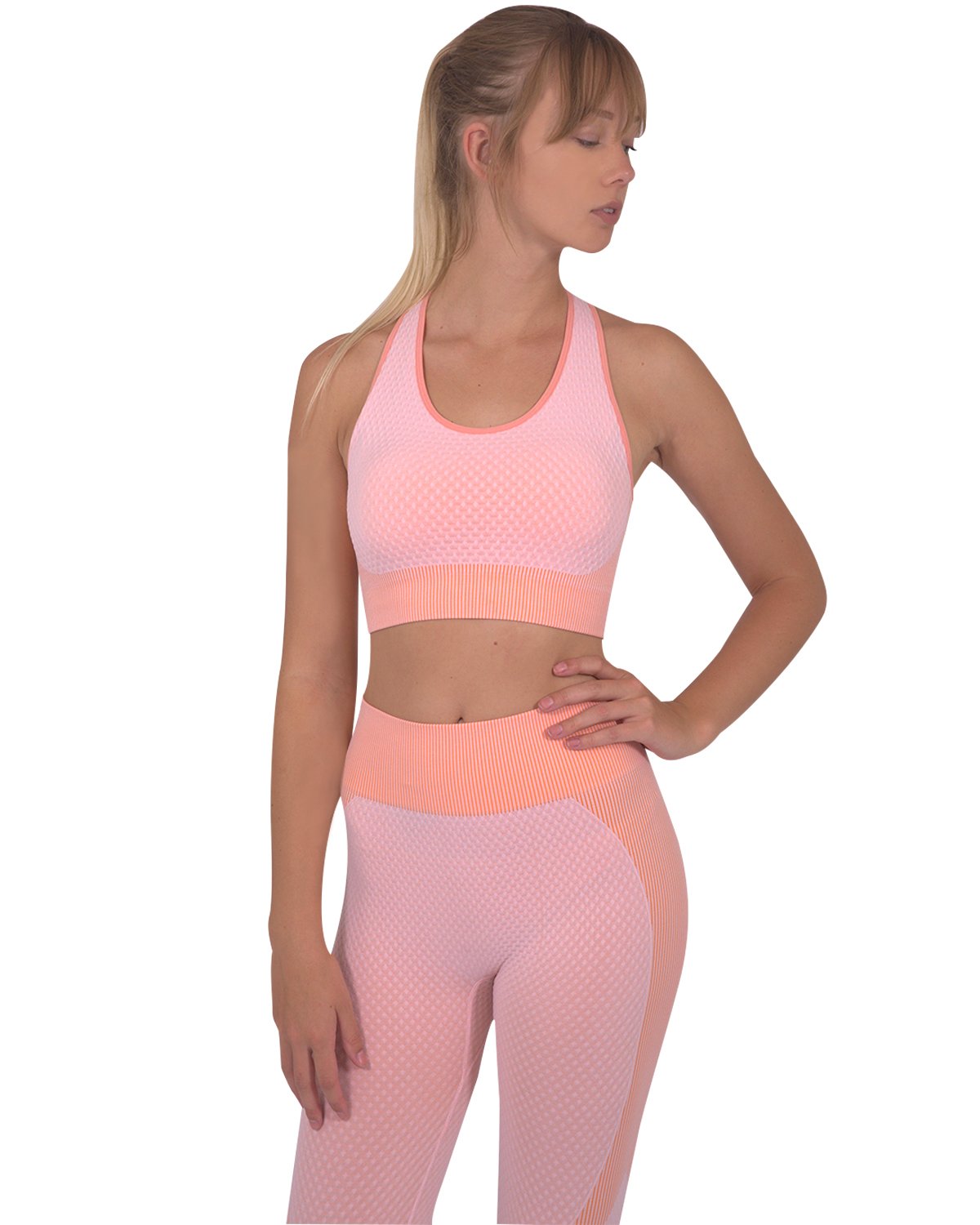 Trois Seamless Sports Bra in pink with orange stripes and cross-over back straps, showcasing its unique design and stylish appearance.