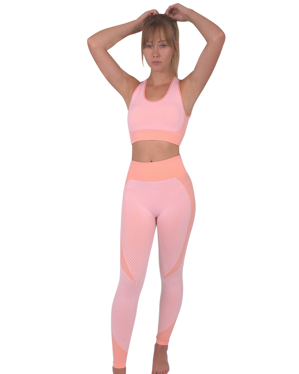 Trois Seamless Sports Bra in pink with orange stripes and cross-over back straps, showcasing its unique design and stylish appearance.