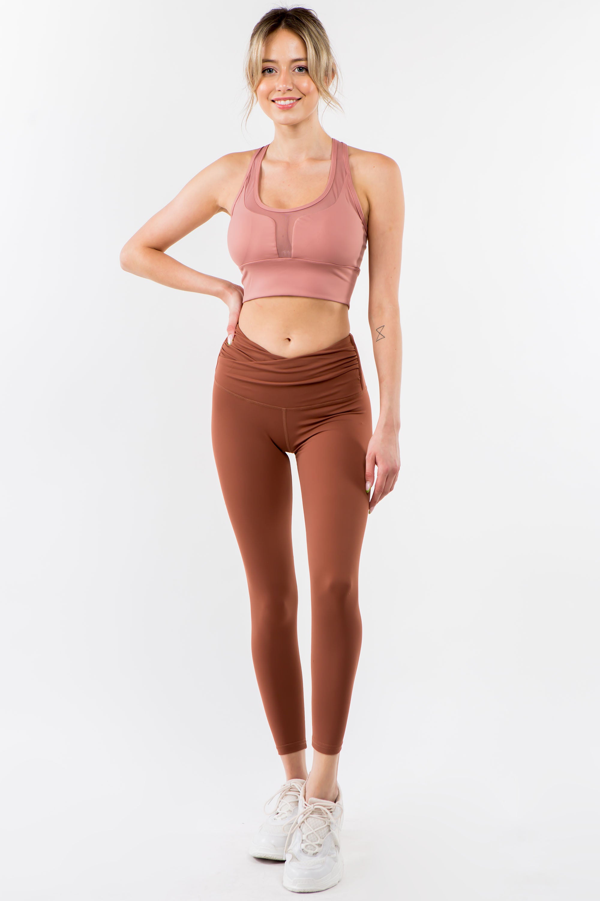 A pair of stylish Twisted Waist Leggings featuring a unique twisted design at the waist, perfect for workouts and casual wear.