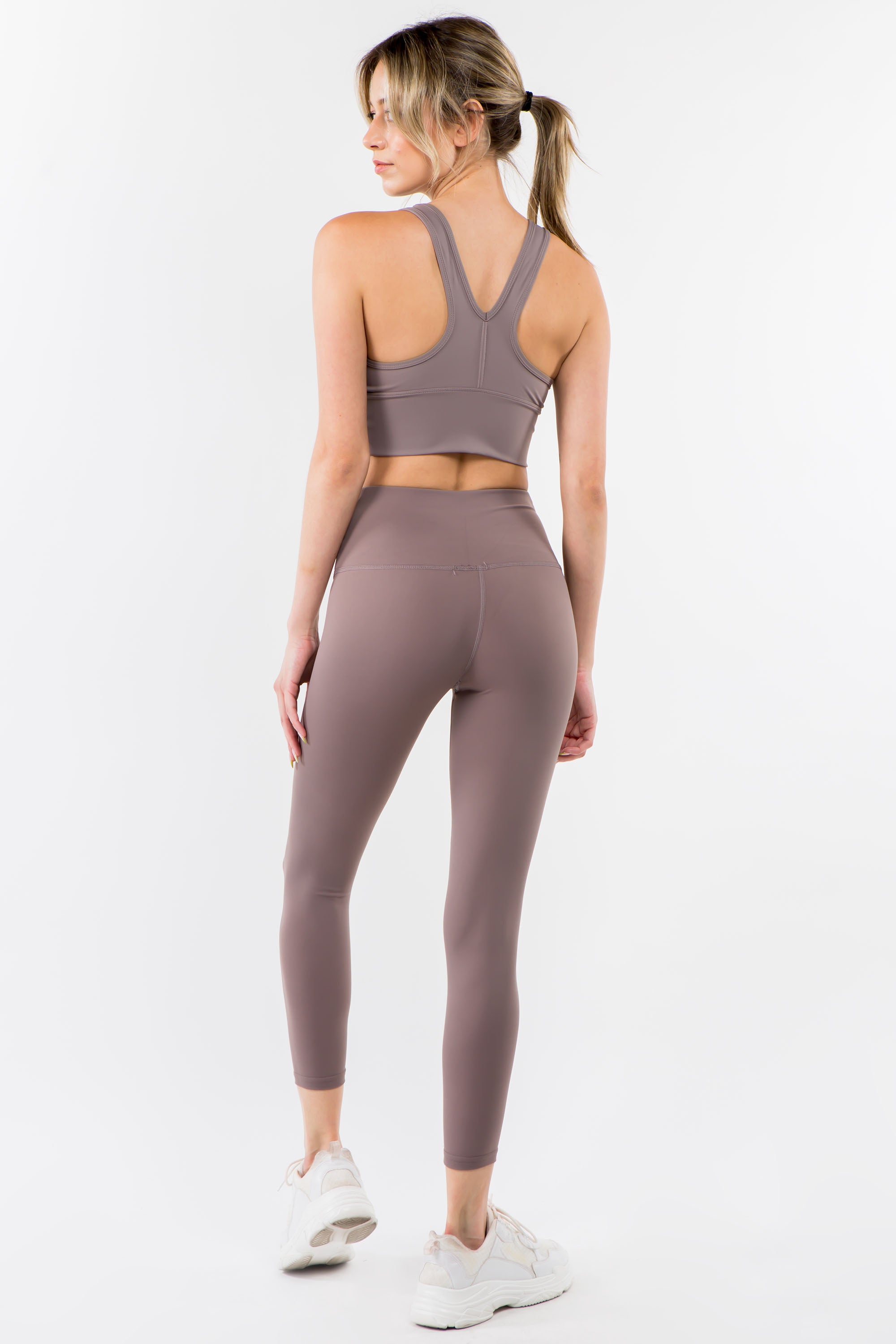 A pair of stylish Twisted Waist Leggings featuring a unique twisted design at the waist, perfect for workouts and casual wear.