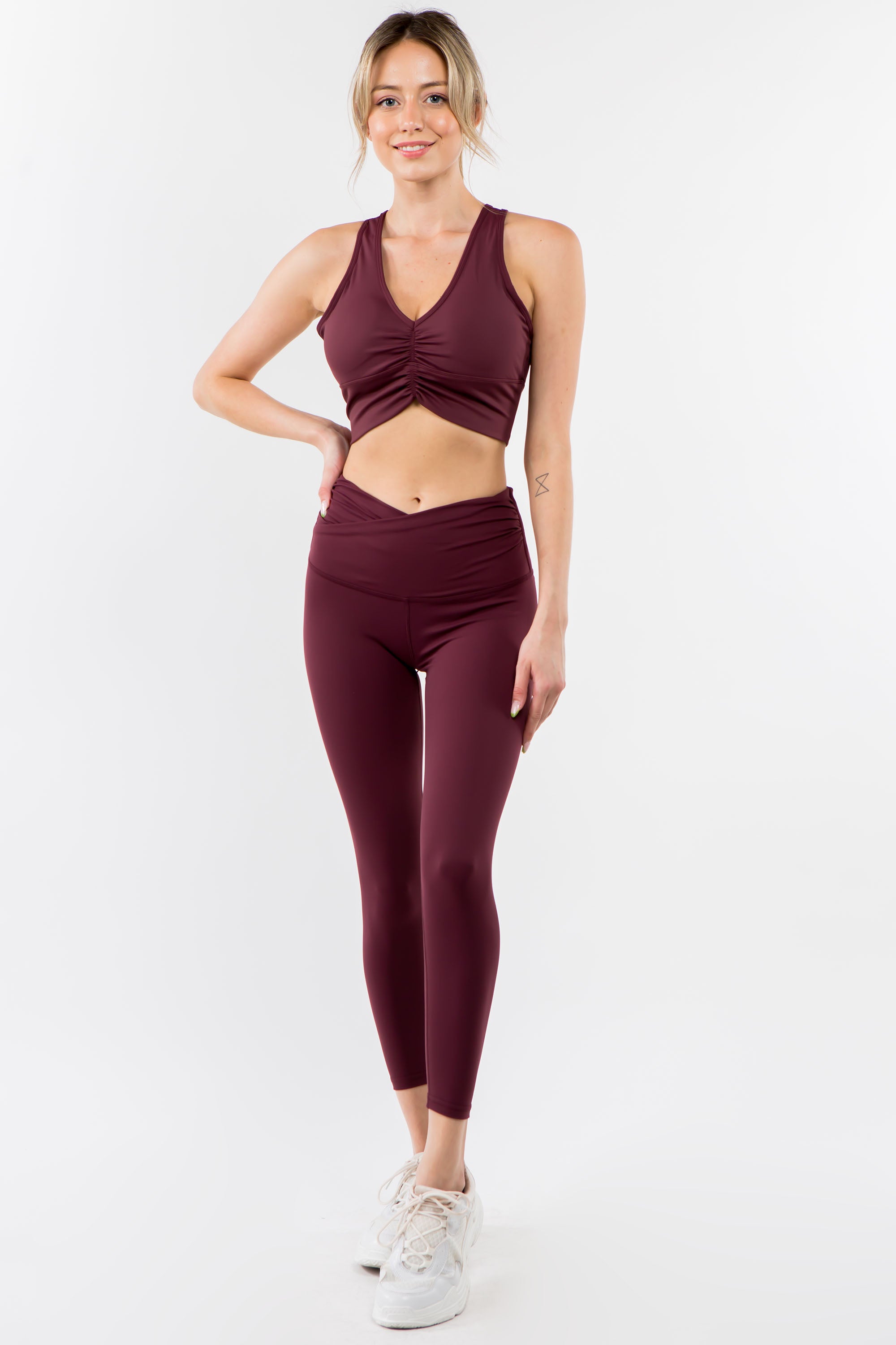 A pair of stylish Twisted Waist Leggings featuring a unique twisted design at the waist, perfect for workouts and casual wear.