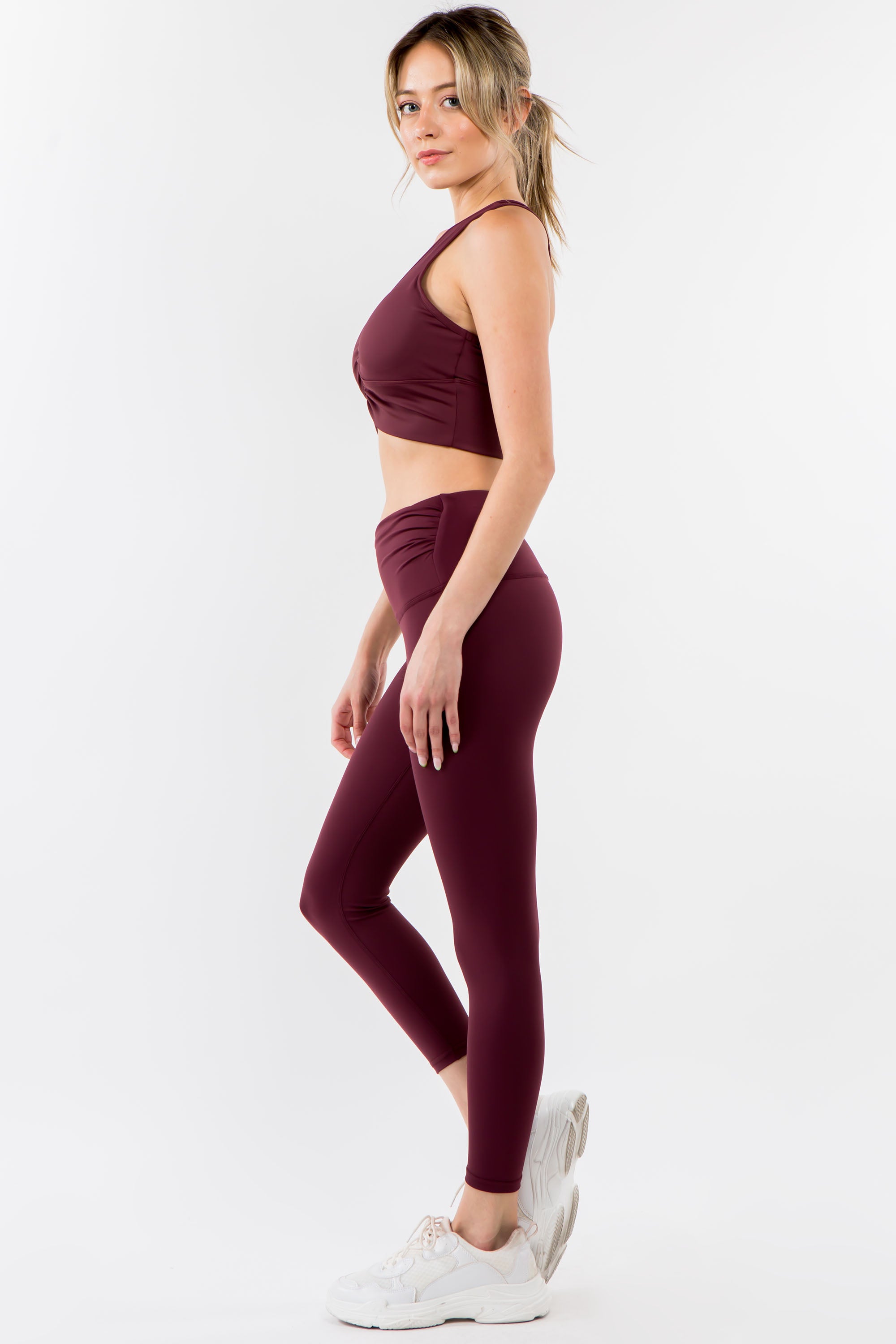 A pair of stylish Twisted Waist Leggings featuring a unique twisted design at the waist, perfect for workouts and casual wear.