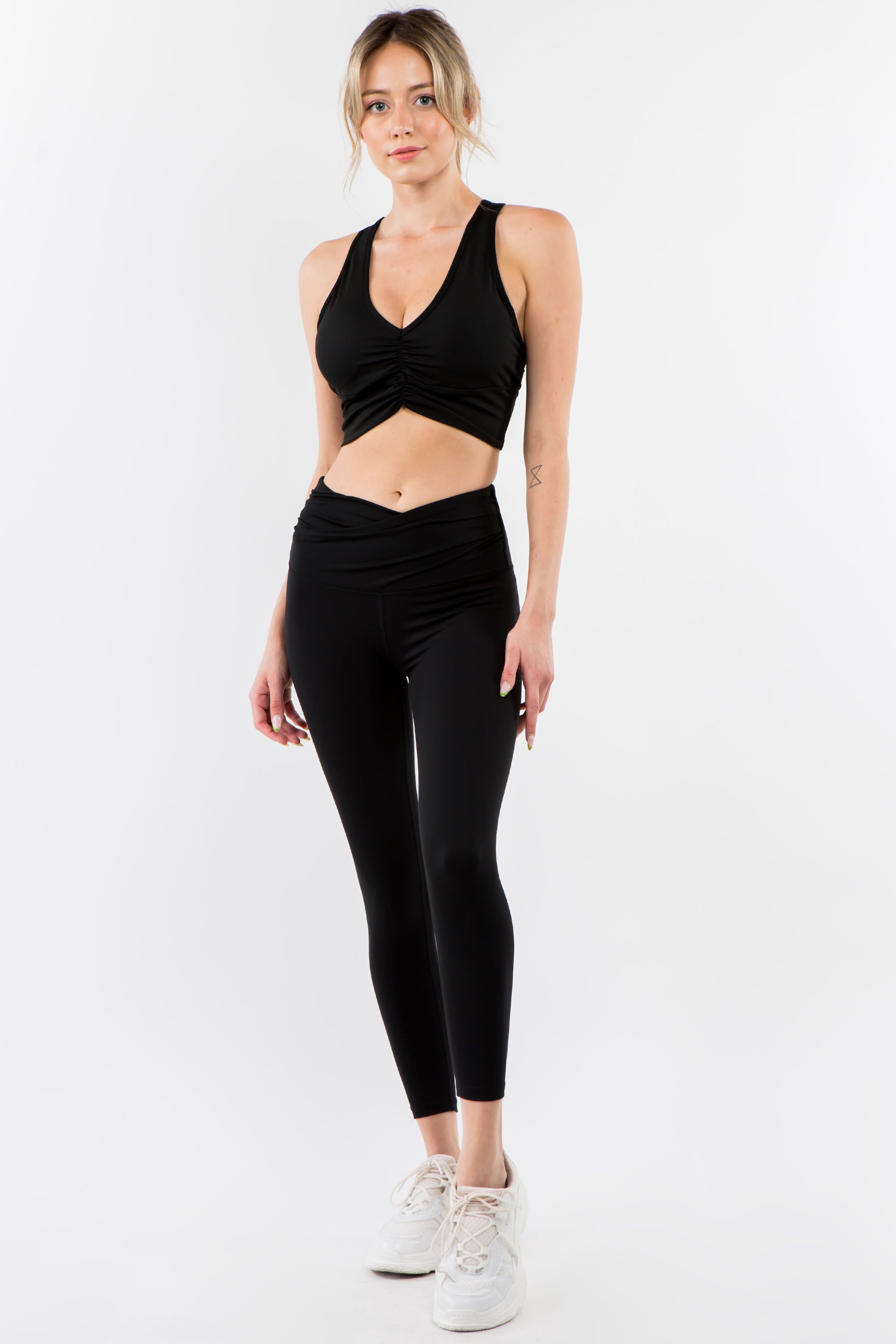 A pair of stylish Twisted Waist Leggings featuring a unique twisted design at the waist, perfect for workouts and casual wear.