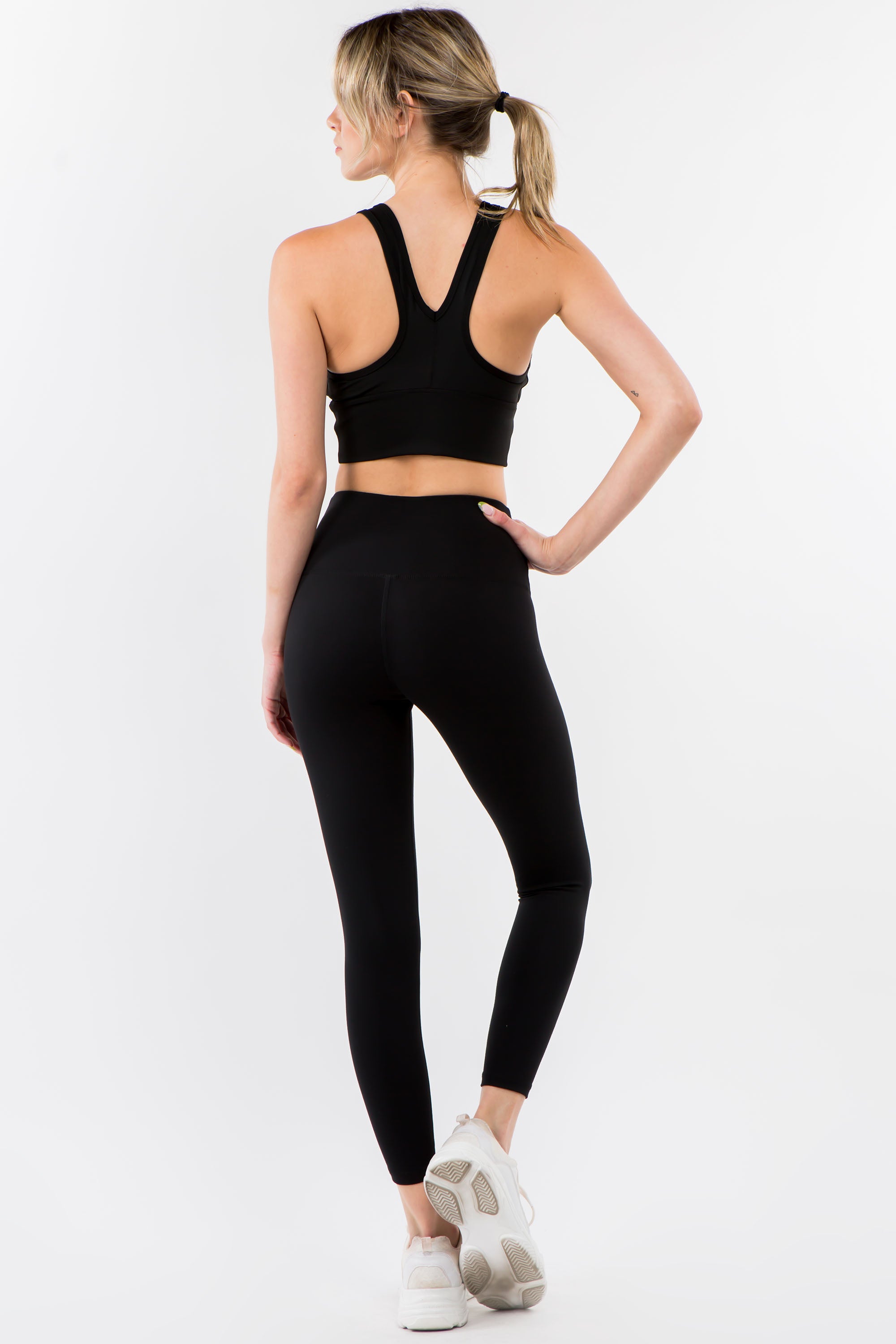 A pair of stylish Twisted Waist Leggings featuring a unique twisted design at the waist, perfect for workouts and casual wear.