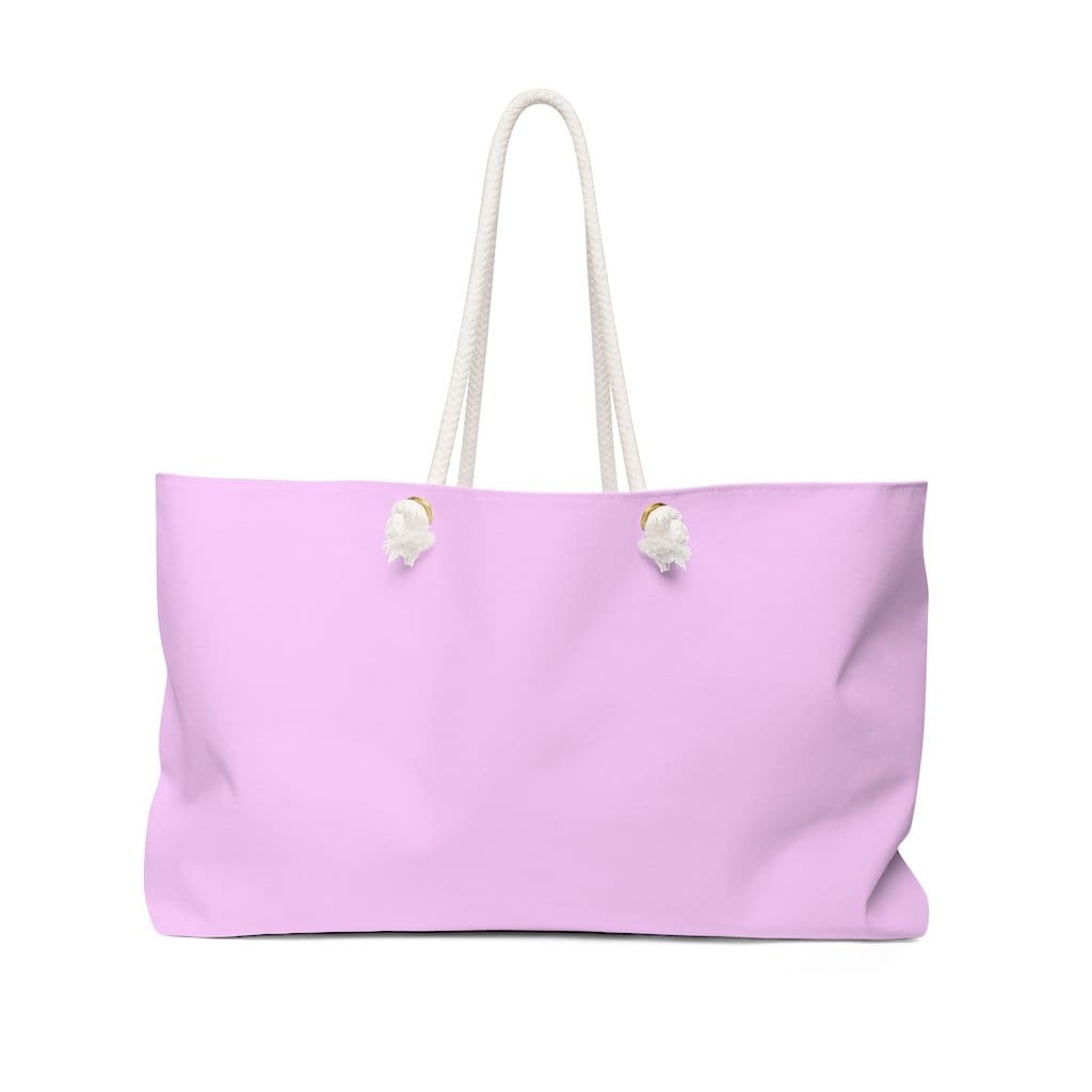 Light pink oversized Weekender Tote Bag with thick rope handles, spacious interior, and laminated lining, perfect for beach trips and casual outings.