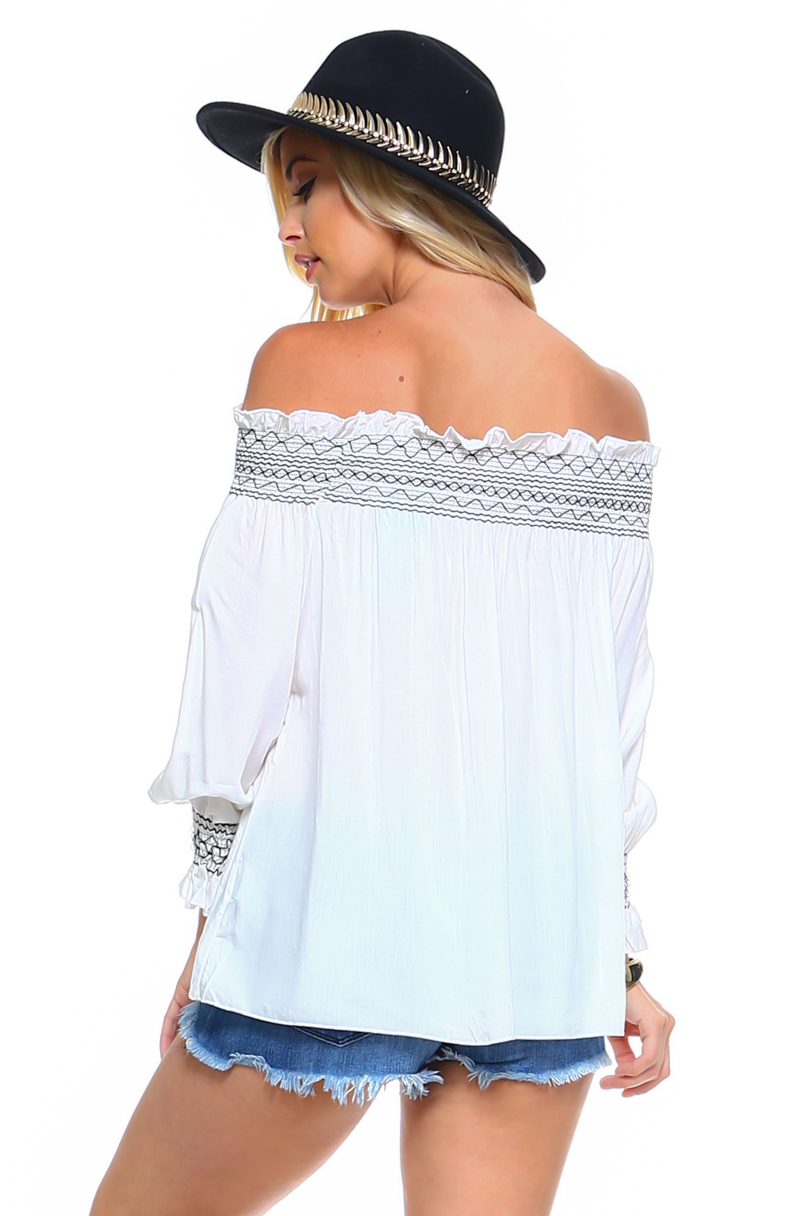 A stylish Women's Off Shoulder Stripe Smocked Elastic Top featuring a smocked design, perfect for summer outings, paired with jean shorts.