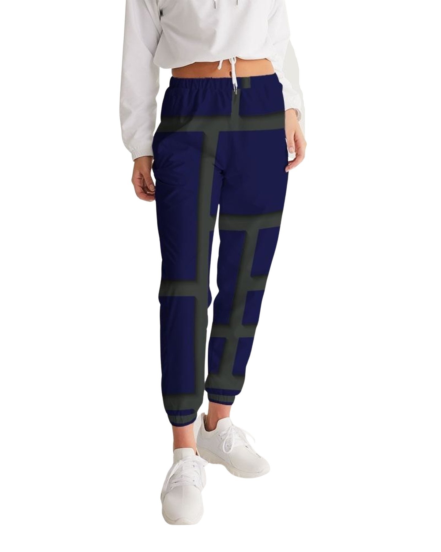 Womens track pants in blue and green geometric graphic, showcasing lightweight and water-resistant fabric with zip pockets.