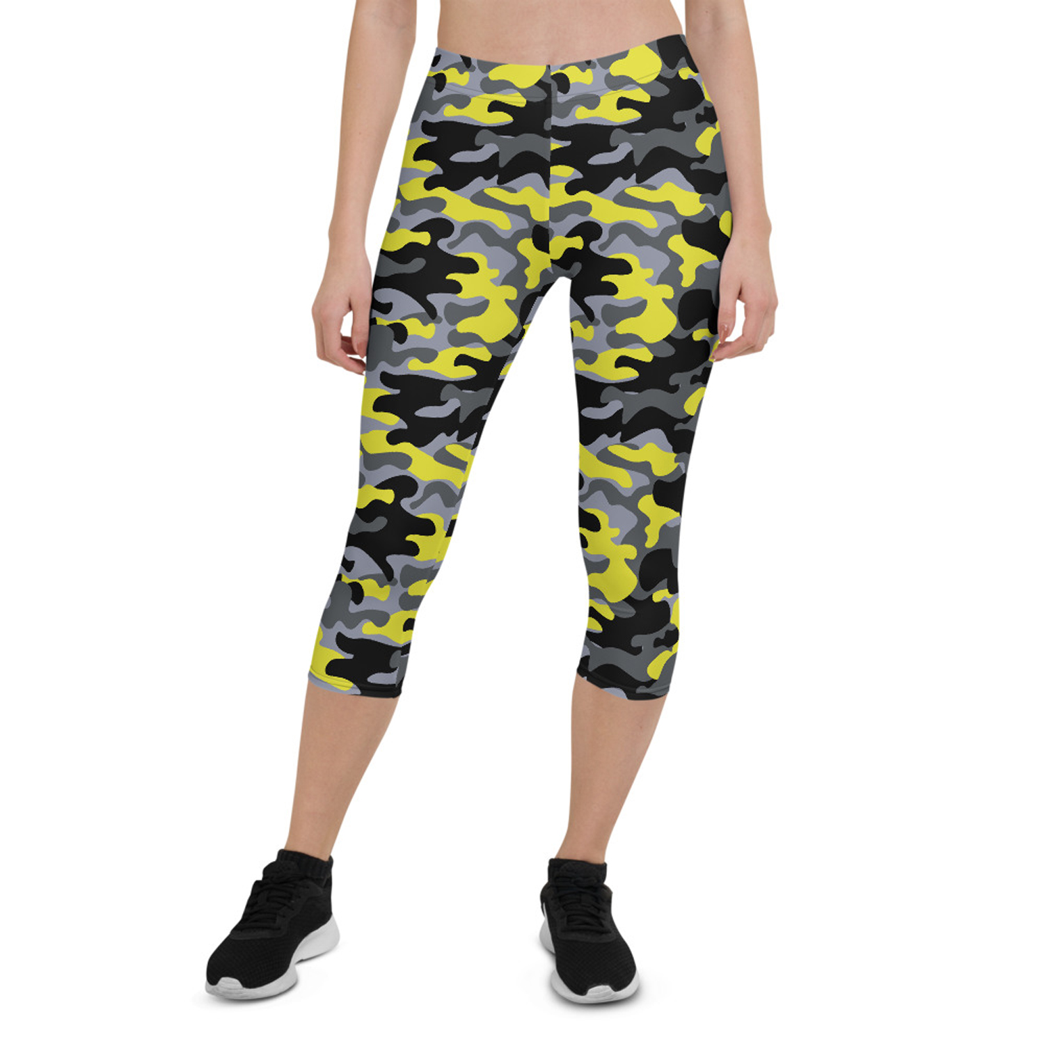 A pair of women's yellow and gray camo capri leggings, showcasing a unique design with a comfortable fit, perfect for workouts and casual wear.