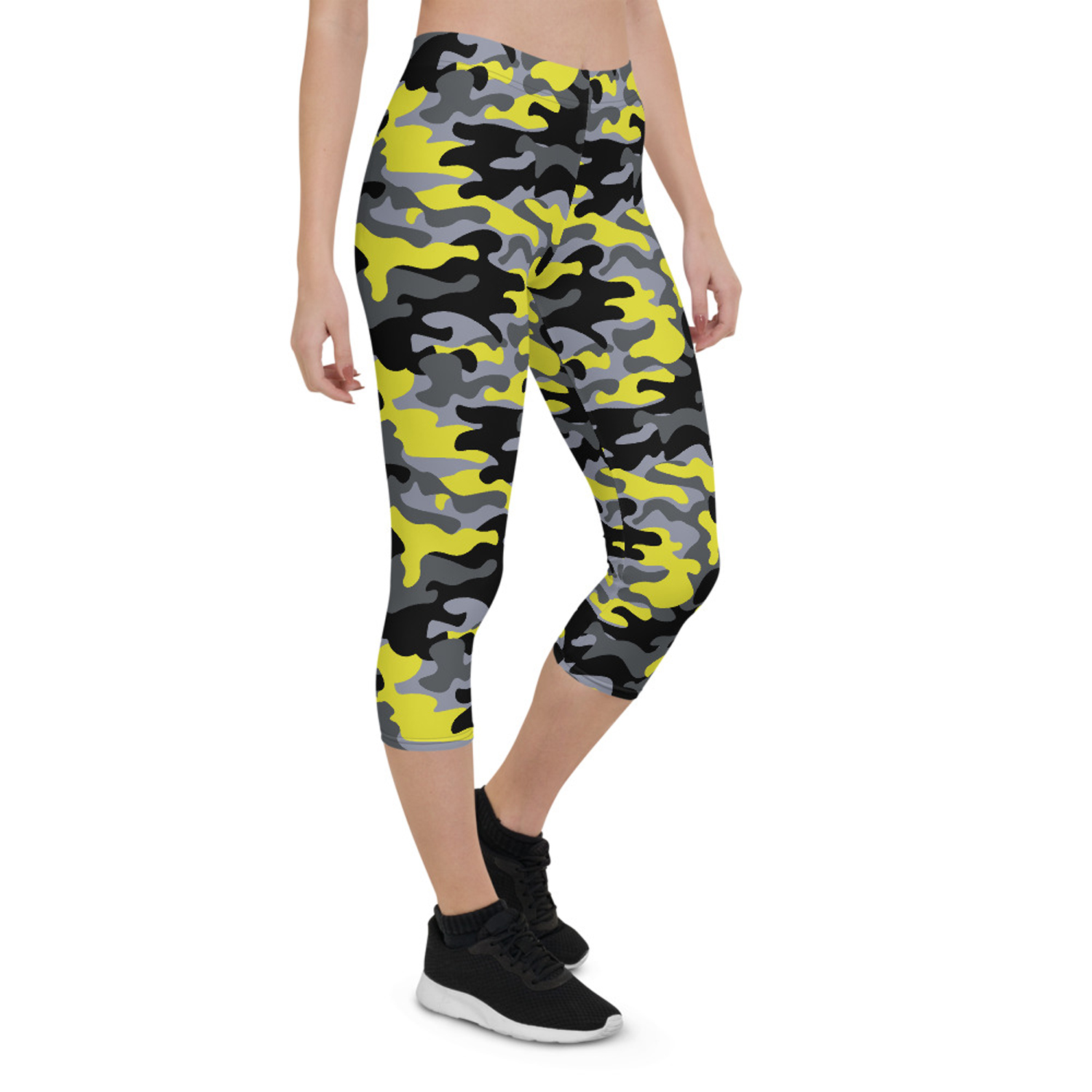 A pair of women's yellow and gray camo capri leggings, showcasing a unique design with a comfortable fit, perfect for workouts and casual wear.