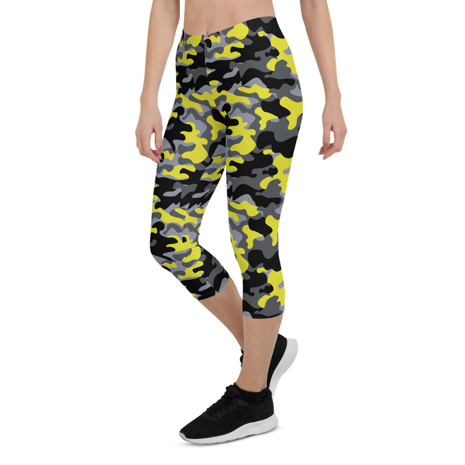 A pair of women's yellow and gray camo capri leggings, showcasing a unique design with a comfortable fit, perfect for workouts and casual wear.