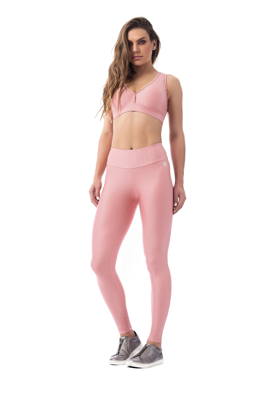 Zilu Sports Bra in blush color with ribbed fabric, featuring an open back and low v-neck design.