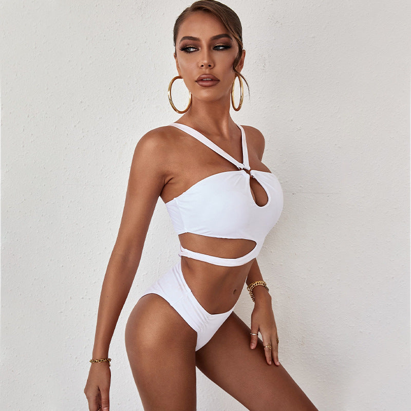 Women's summer one piece swimsuit in solid color with hollow backless design, showcasing stylish and sexy features perfect for beach outings.