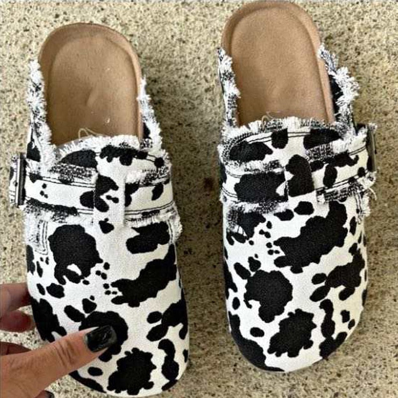 A pair of Women's Vintage Clogs showcasing various designs including beige, leopard, cows, army, striped, and black, highlighting their stylish and comfortable features.