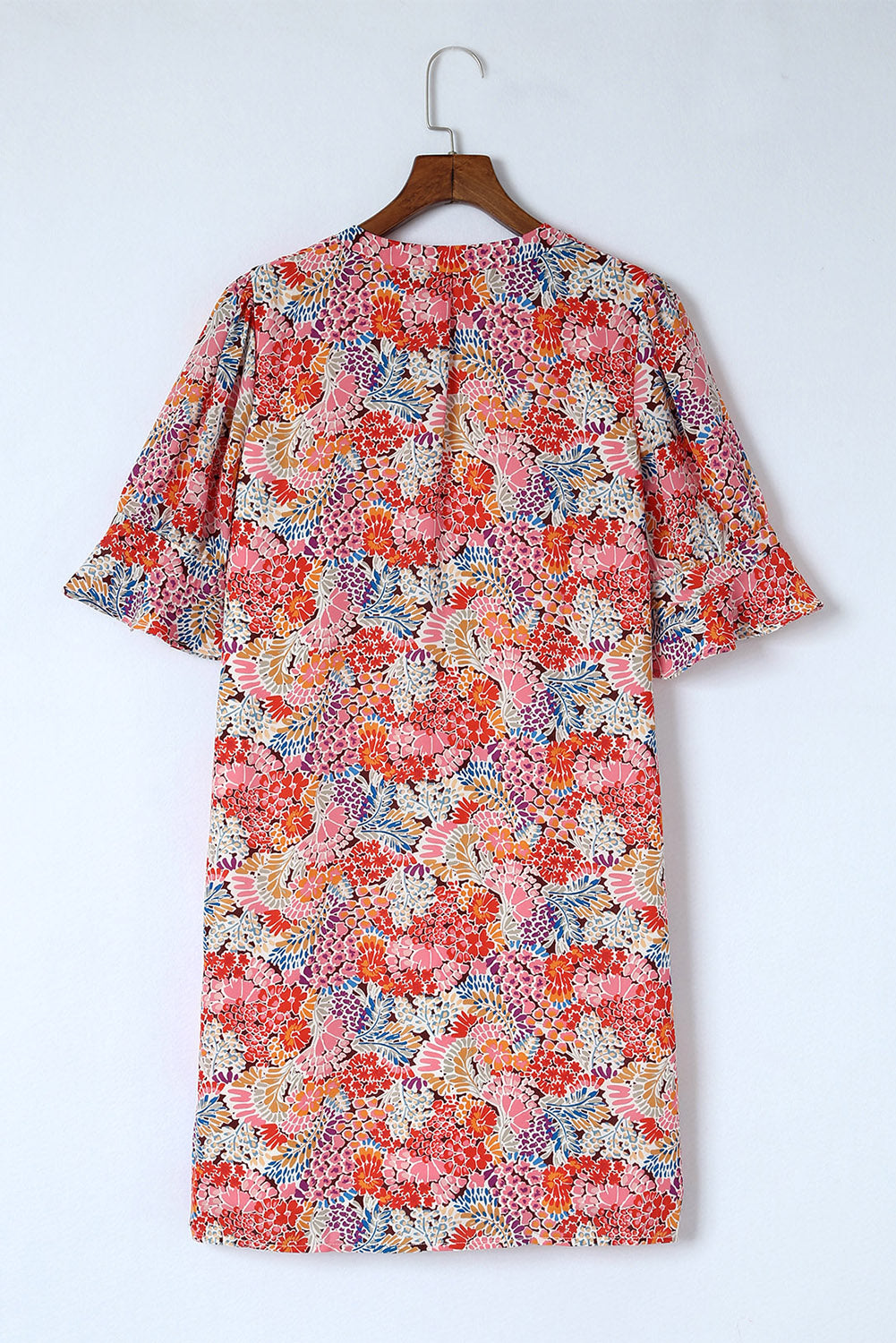 A beautiful Boho Floral Flutter Sleeve Dress featuring a V-neck, short flutter sleeves, and elegant floral patterns, perfect for summer outings.