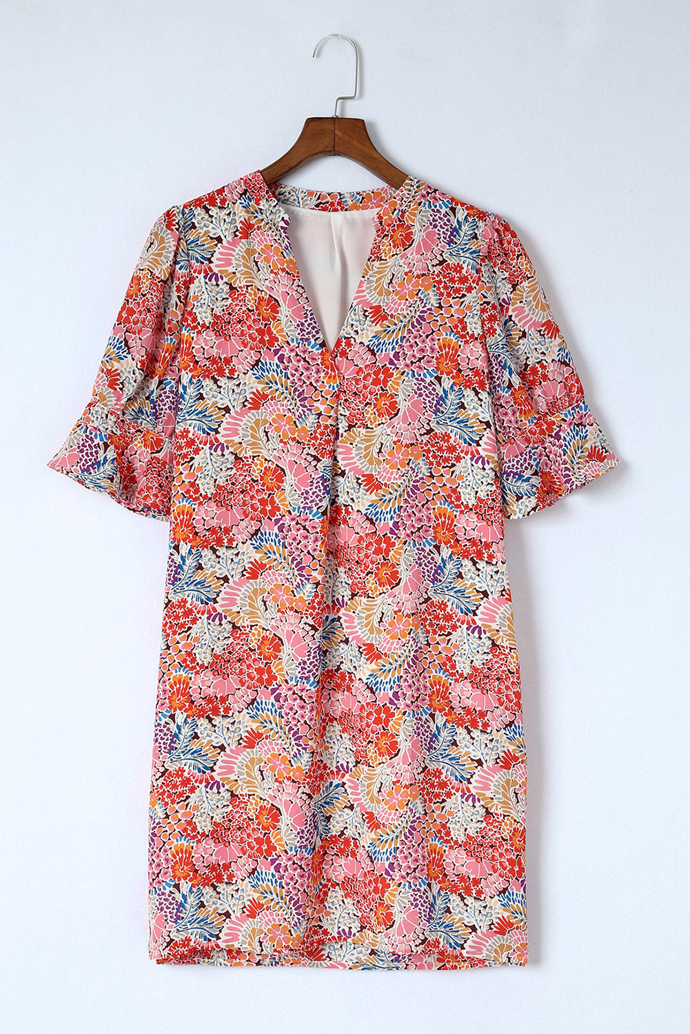 A beautiful Boho Floral Flutter Sleeve Dress featuring a V-neck, short flutter sleeves, and elegant floral patterns, perfect for summer outings.