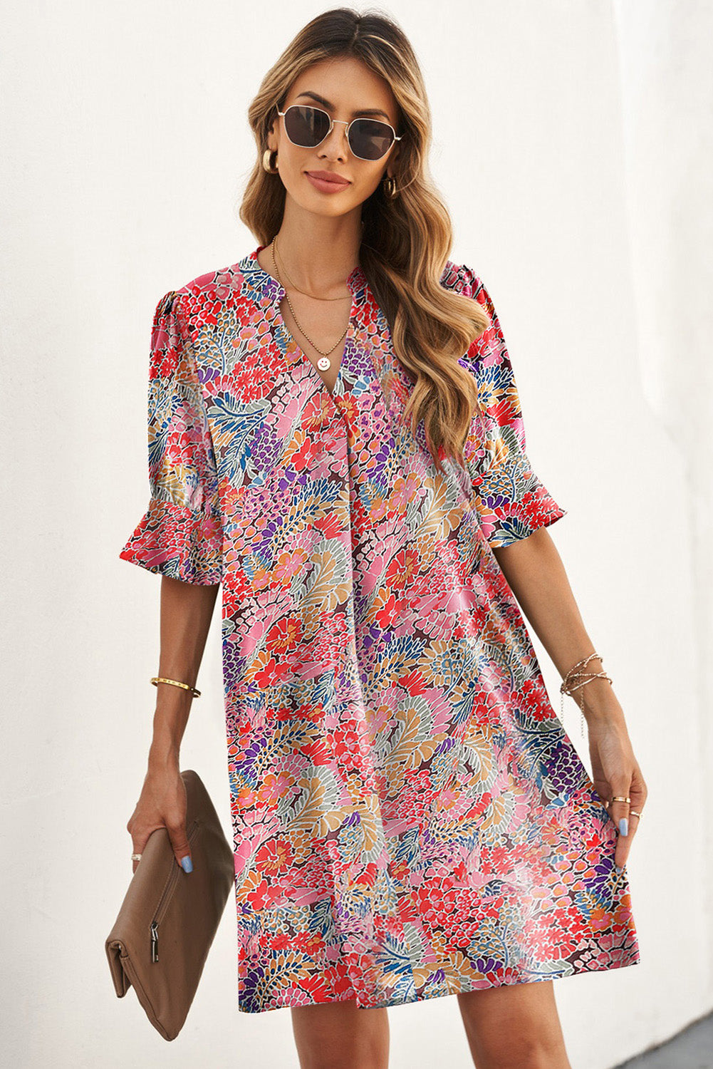 A beautiful Boho Floral Flutter Sleeve Dress featuring a V-neck, short flutter sleeves, and elegant floral patterns, perfect for summer outings.