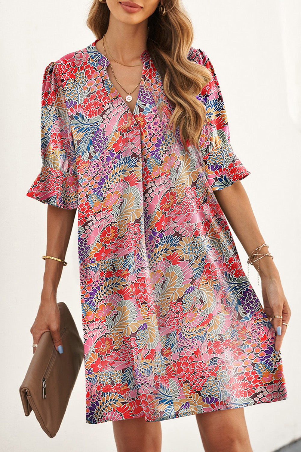 A beautiful Boho Floral Flutter Sleeve Dress featuring a V-neck, short flutter sleeves, and elegant floral patterns, perfect for summer outings.