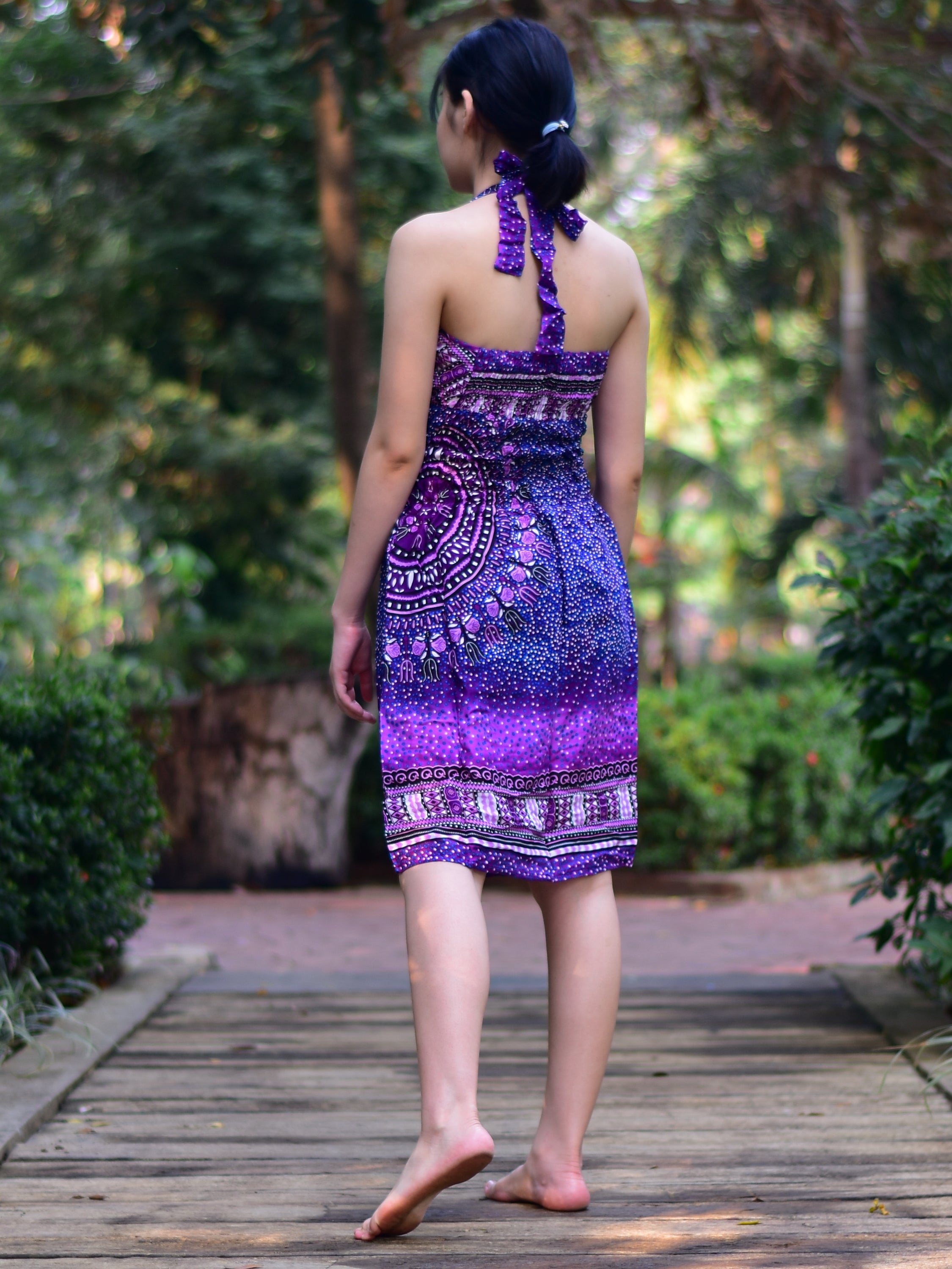 Bohotusk Purple Night Sky Tie Neck Knee Length Dress featuring a stylish tie neck and elasticated smocked chest, perfect for summer wear.