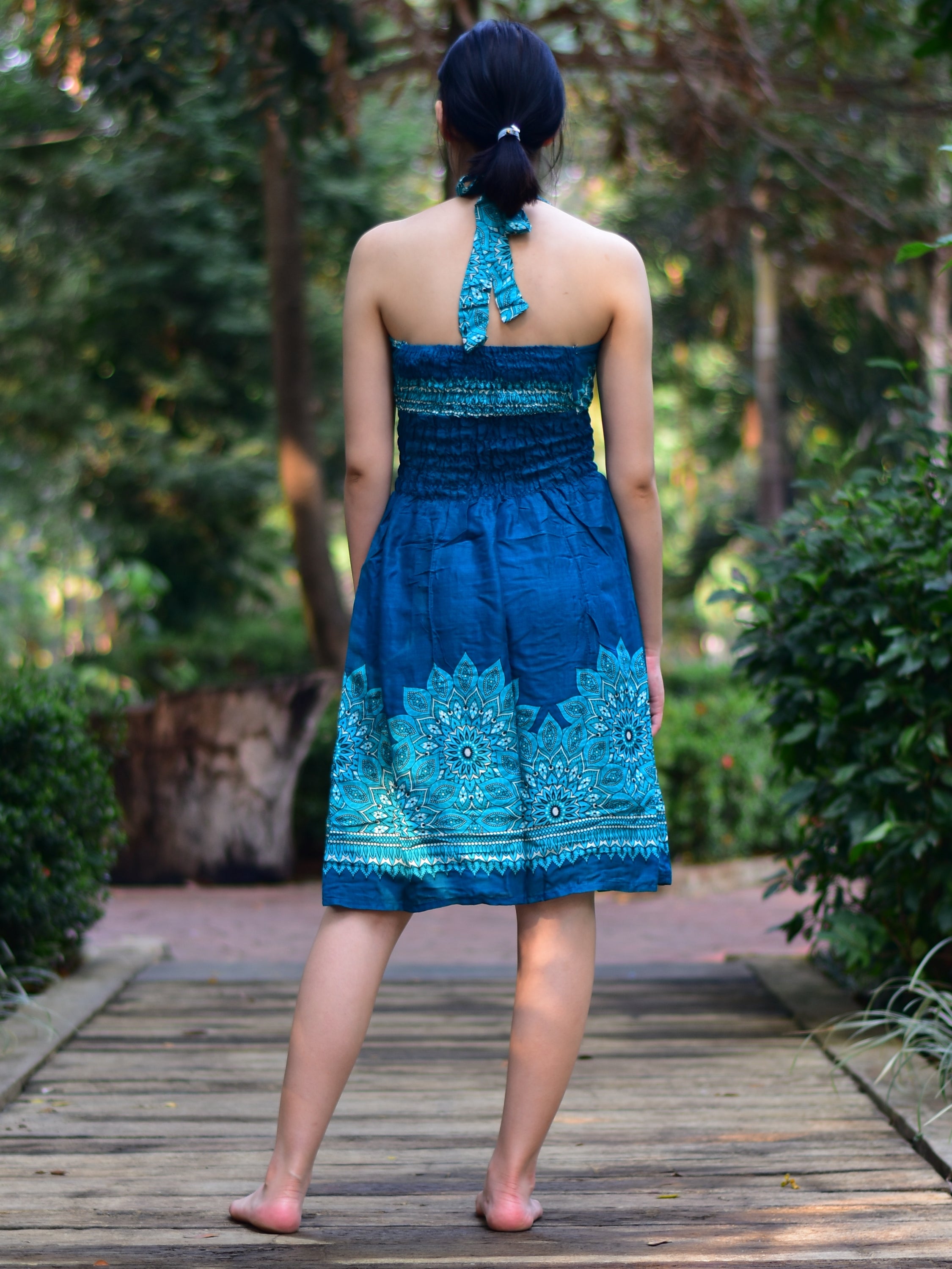 Bohotusk Teal Tigers Eye Tie Neck Knee Length Dress featuring a stylish tie neck and elasticated smocked chest, perfect for summer wear.