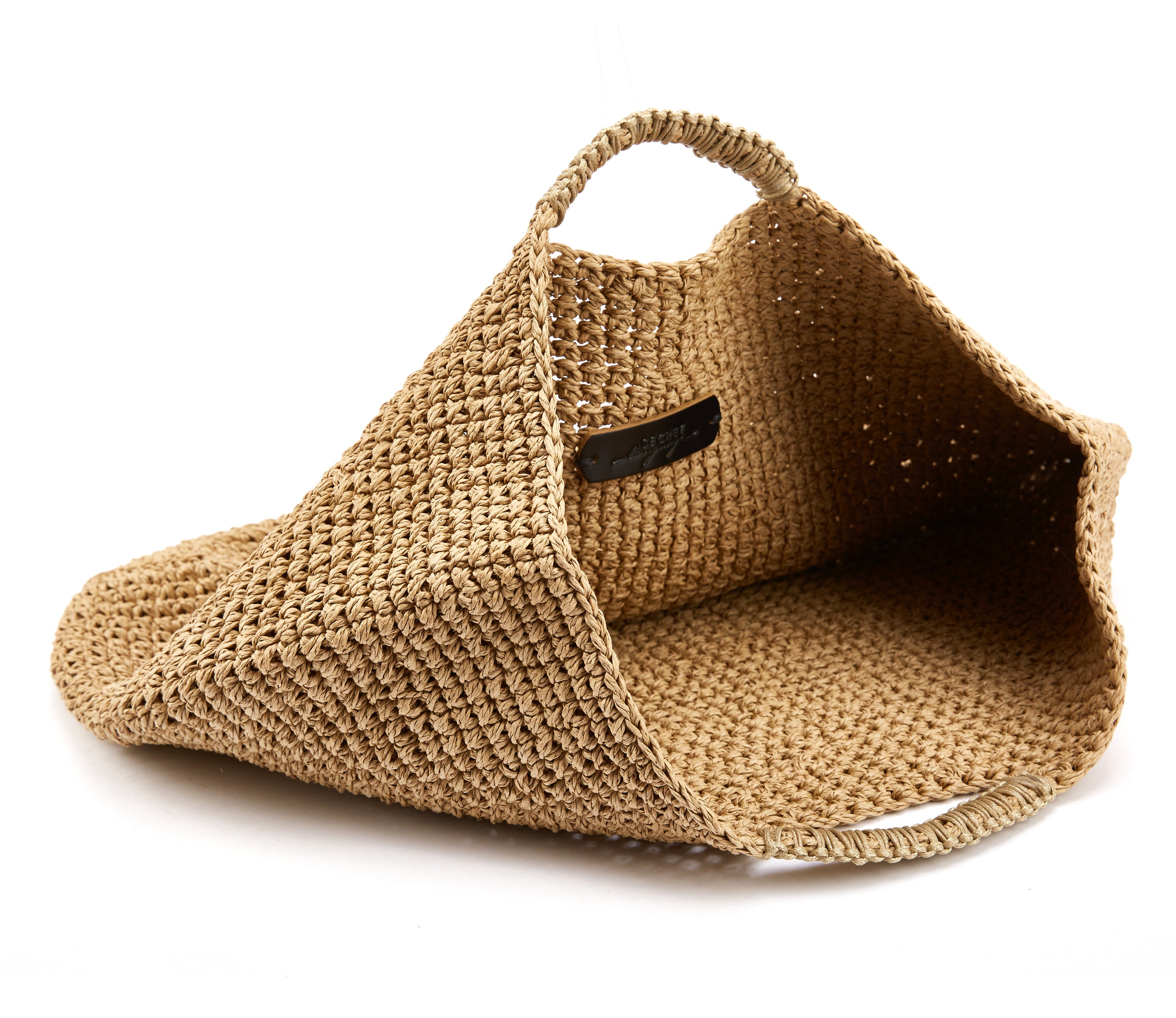 Capri Tote Bag handwoven from paper rope with beige leather trim, spacious and stylish for errands or beach outings.