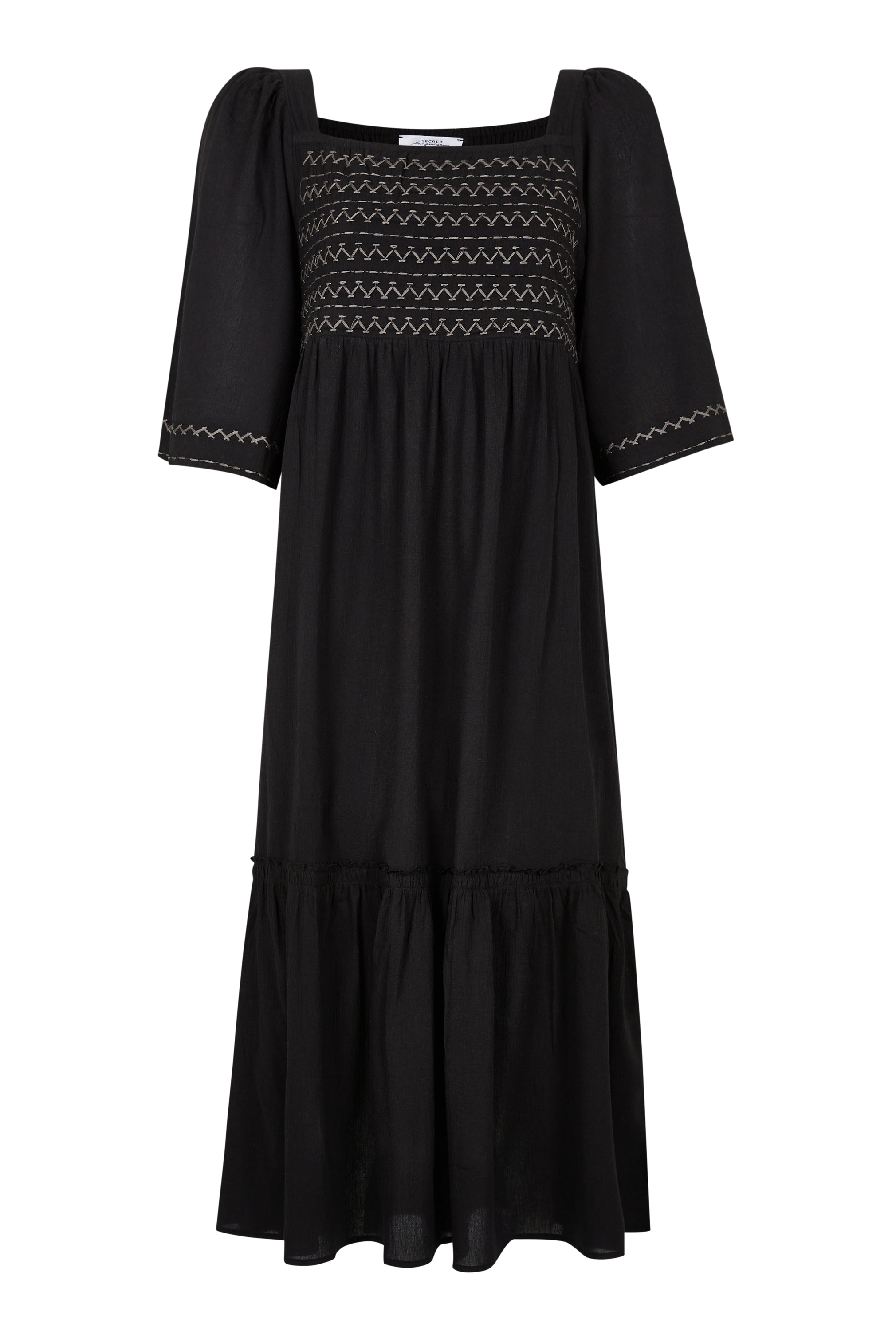 CASSIE MAXI DRESS in black featuring geometric embroidery and flexible shirring, perfect for summer outings.