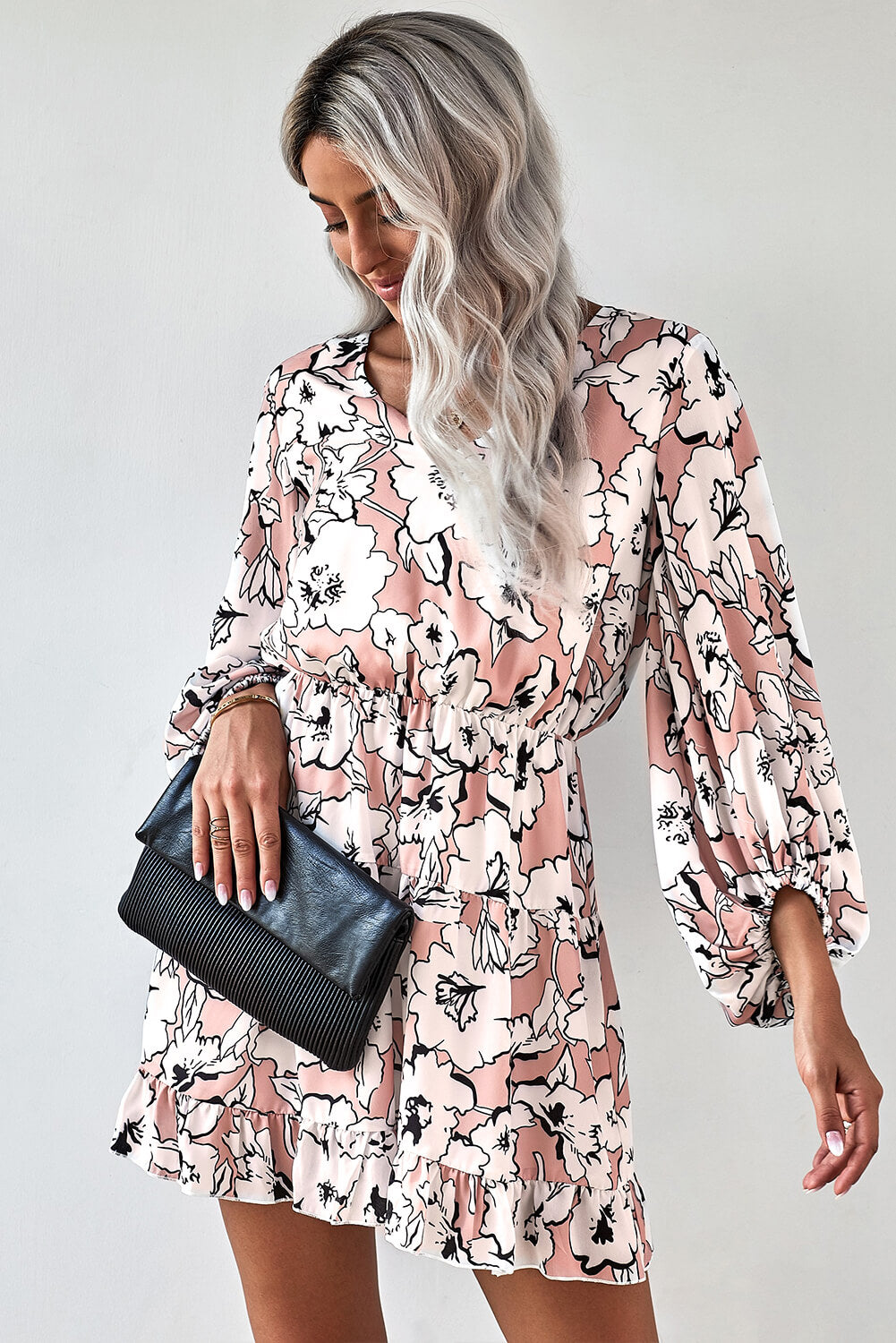 Chic apricot floral tunic dress featuring a v-neck and lantern sleeves, perfect for casual summer outings.