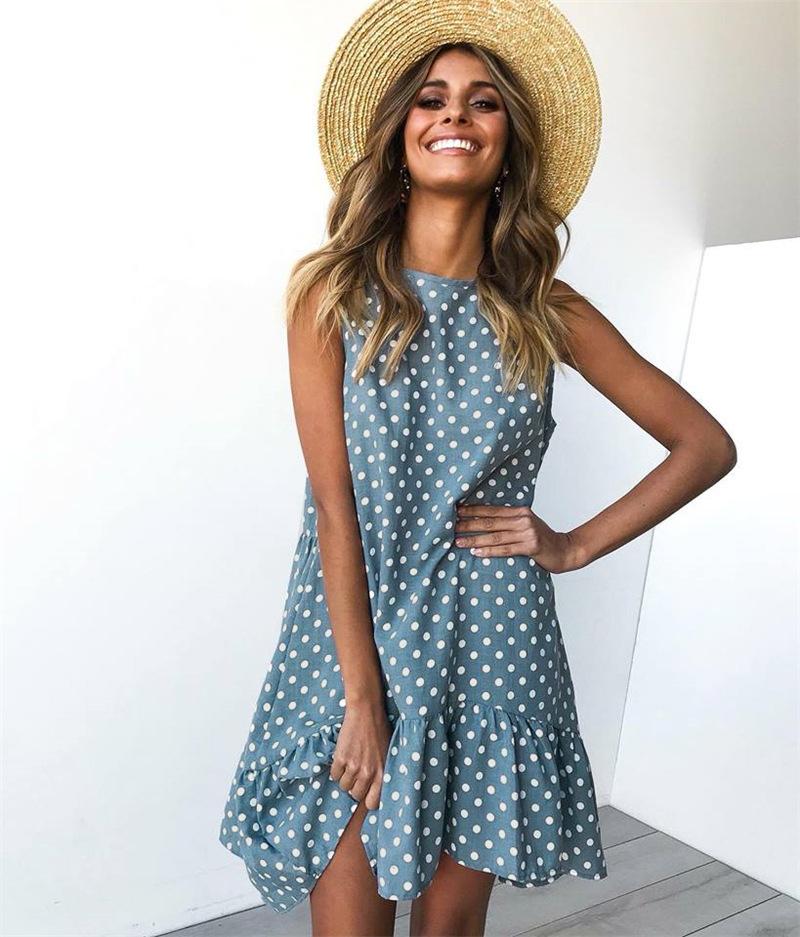 A stylish women's boho beach sundress featuring floral prints and polka dots, perfect for summer outings.