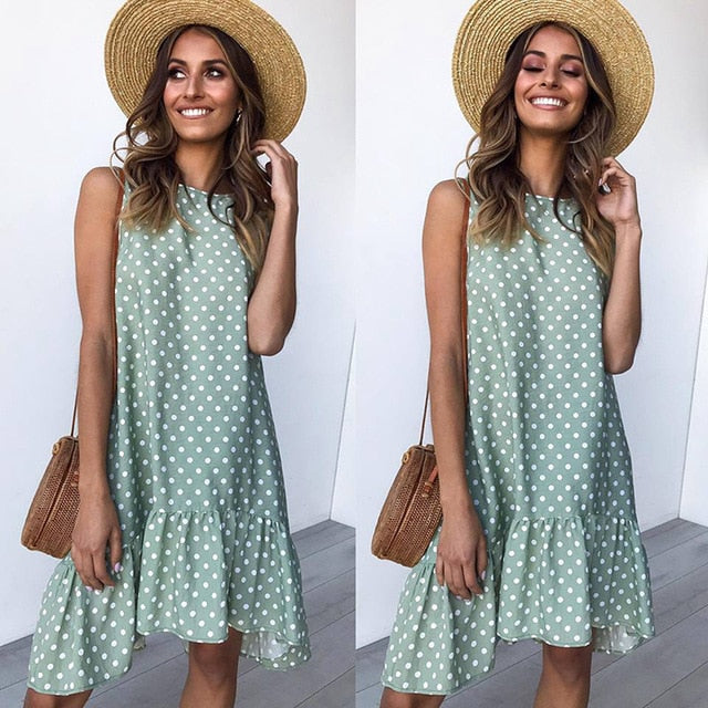 A stylish women's boho beach sundress featuring floral prints and polka dots, perfect for summer outings.