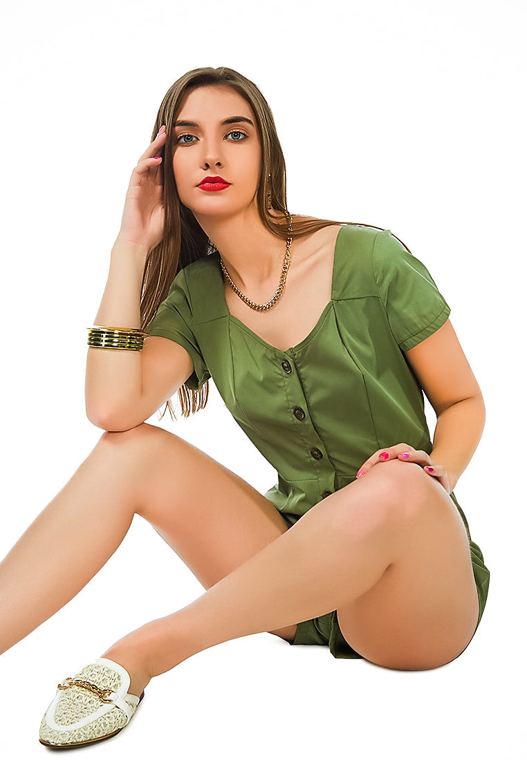 Fair Play Button-Up Romper in vibrant green with scoop neck and button-up design, perfect for summer wear.