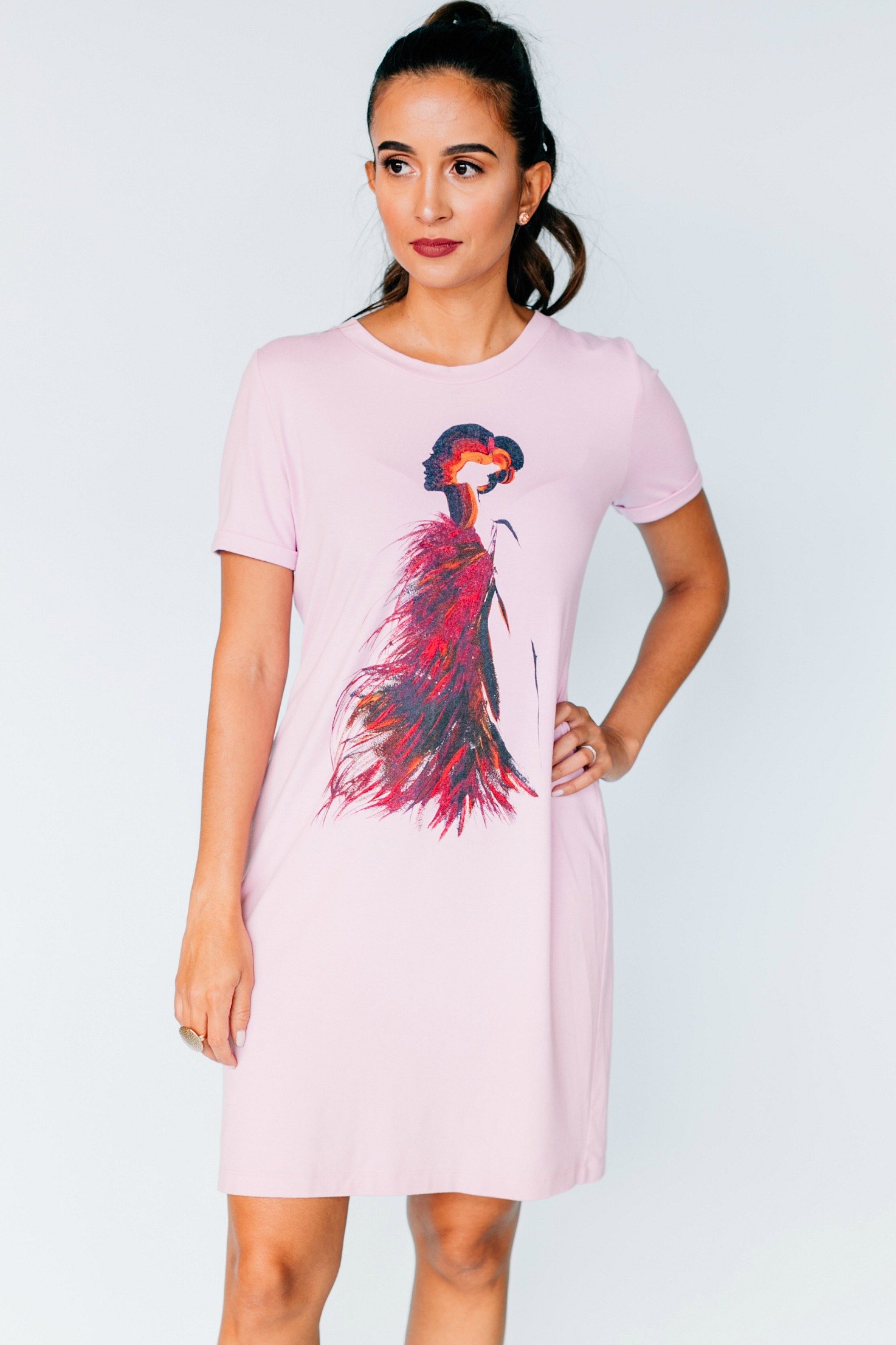 A stylish Firestarter Dress featuring a tailored silhouette, cuffed 3/4 sleeves, and unique custom artwork in Pink Lavender color.