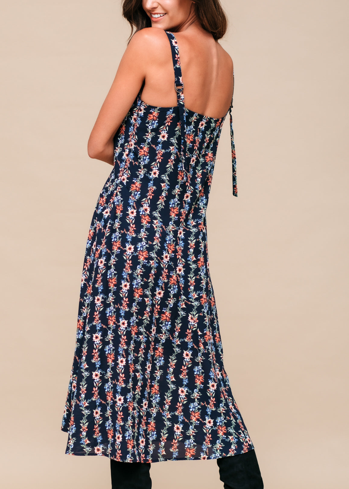 A beautiful Floral V-Neck Sleeveless Maxi Dress featuring a vibrant floral pattern, perfect for summer occasions.