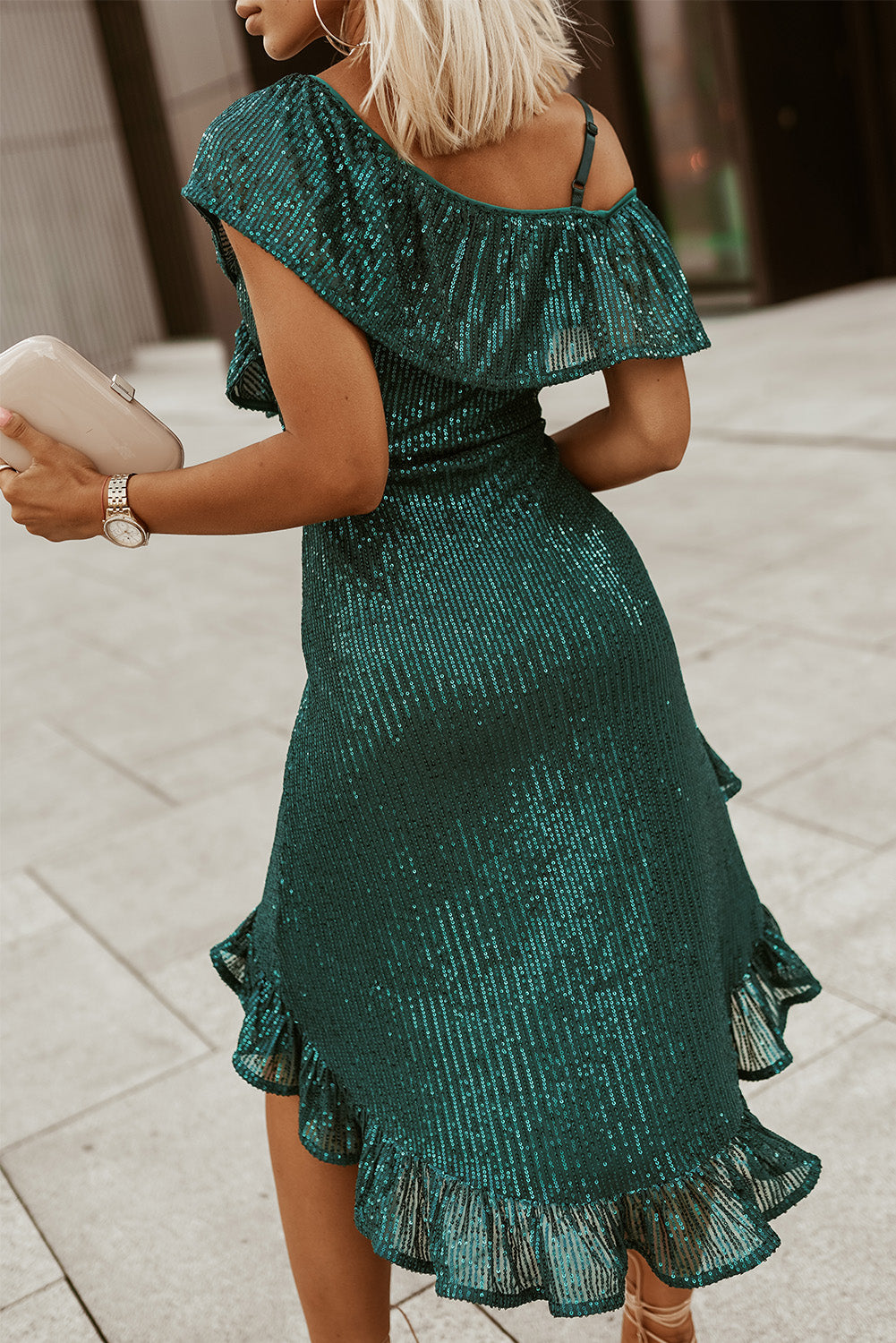 A glamorous green one-shoulder sequin dress featuring ruffled neckline and high-low hem, perfect for parties and formal events.