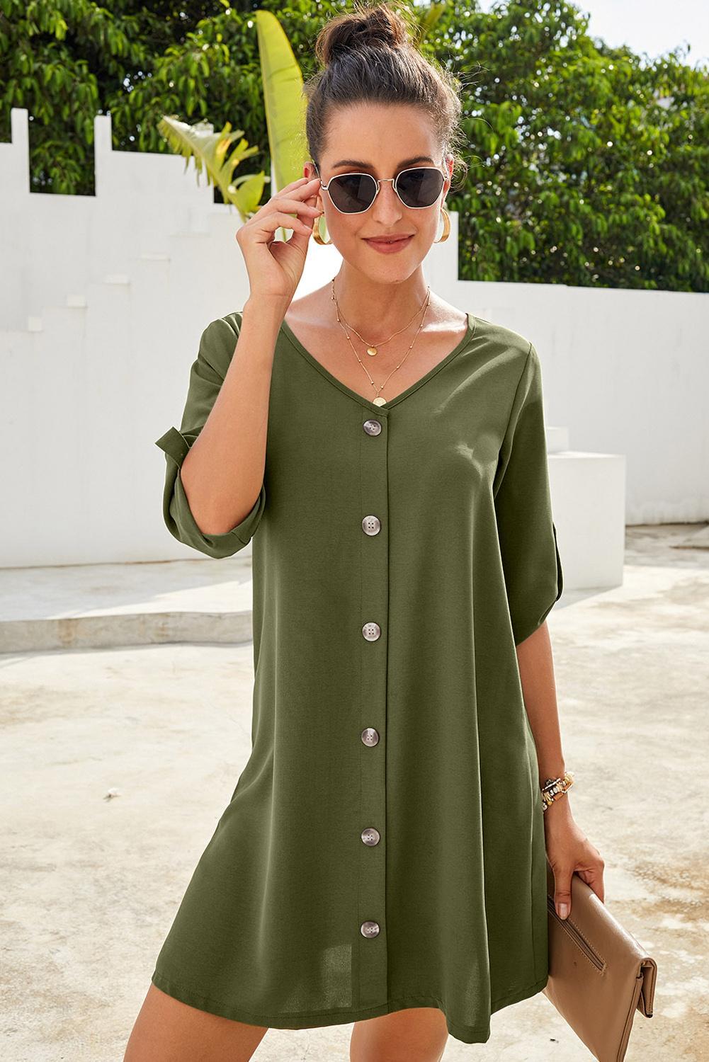 A stylish green v-neck dress with button front and roll-up tab sleeves, perfect for casual spring outings.