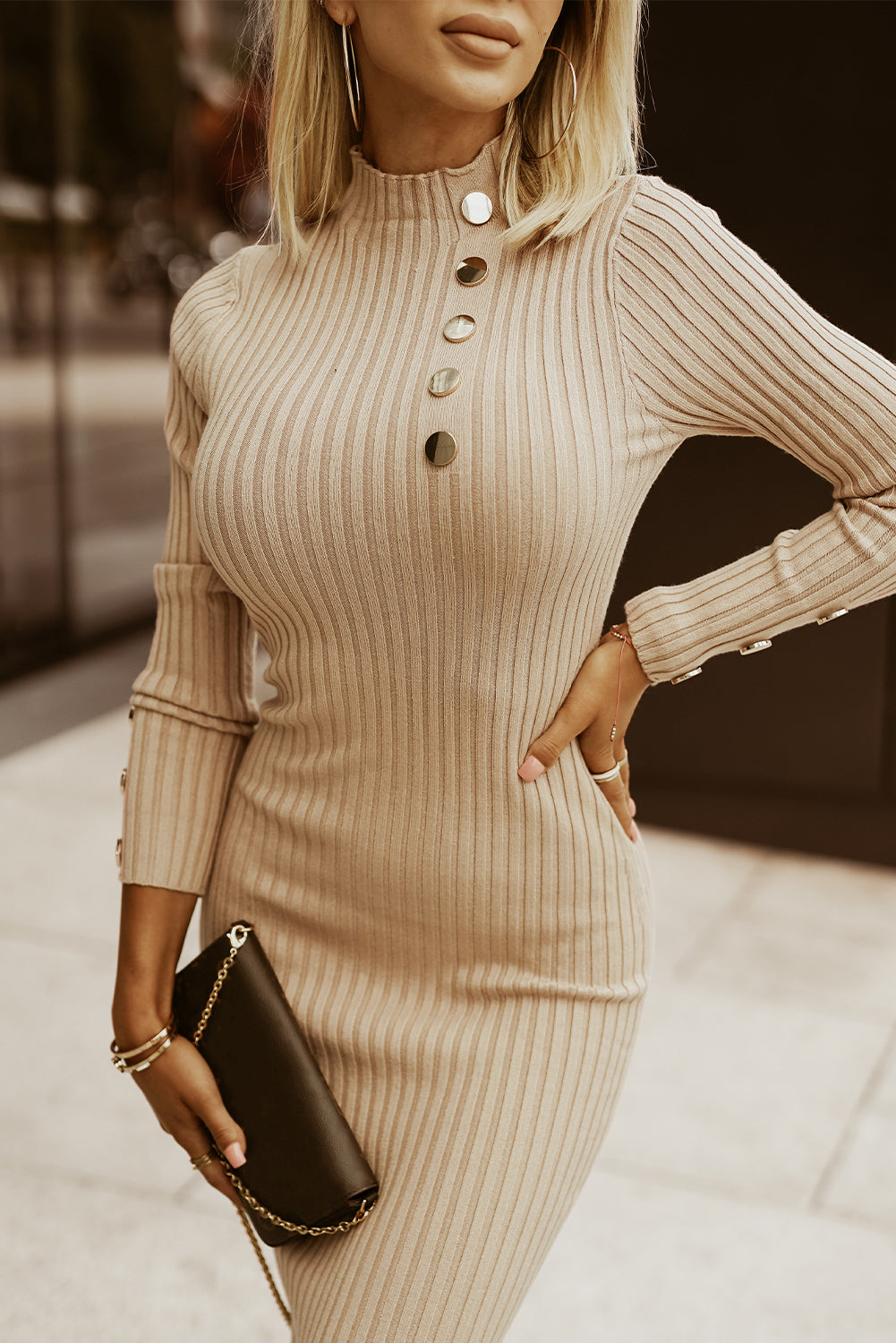 A stylish high neck sweater dress featuring long sleeves, a bodycon fit, and elegant metal button details, perfect for winter fashion.