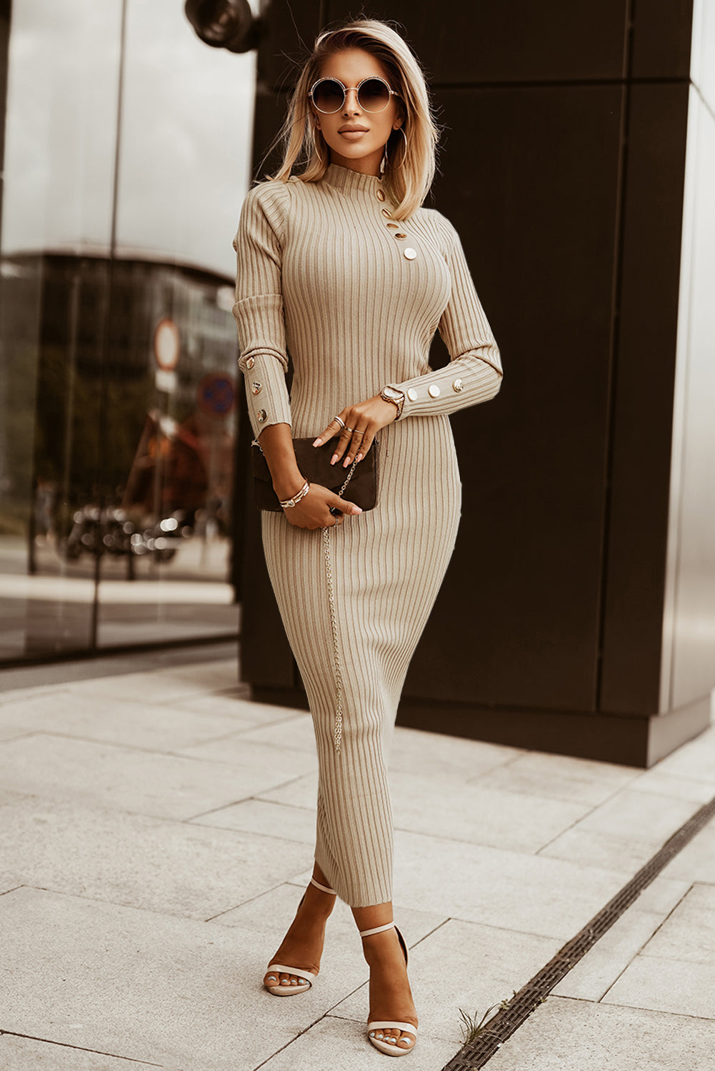 A stylish high neck sweater dress featuring long sleeves, a bodycon fit, and elegant metal button details, perfect for winter fashion.