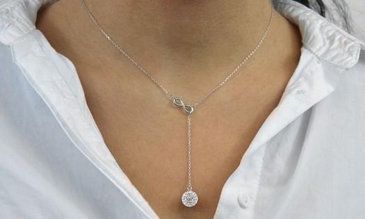 Infinity Y Necklace featuring Swarovski Crystals, white gold plated, elegant design with infinity symbol connector.