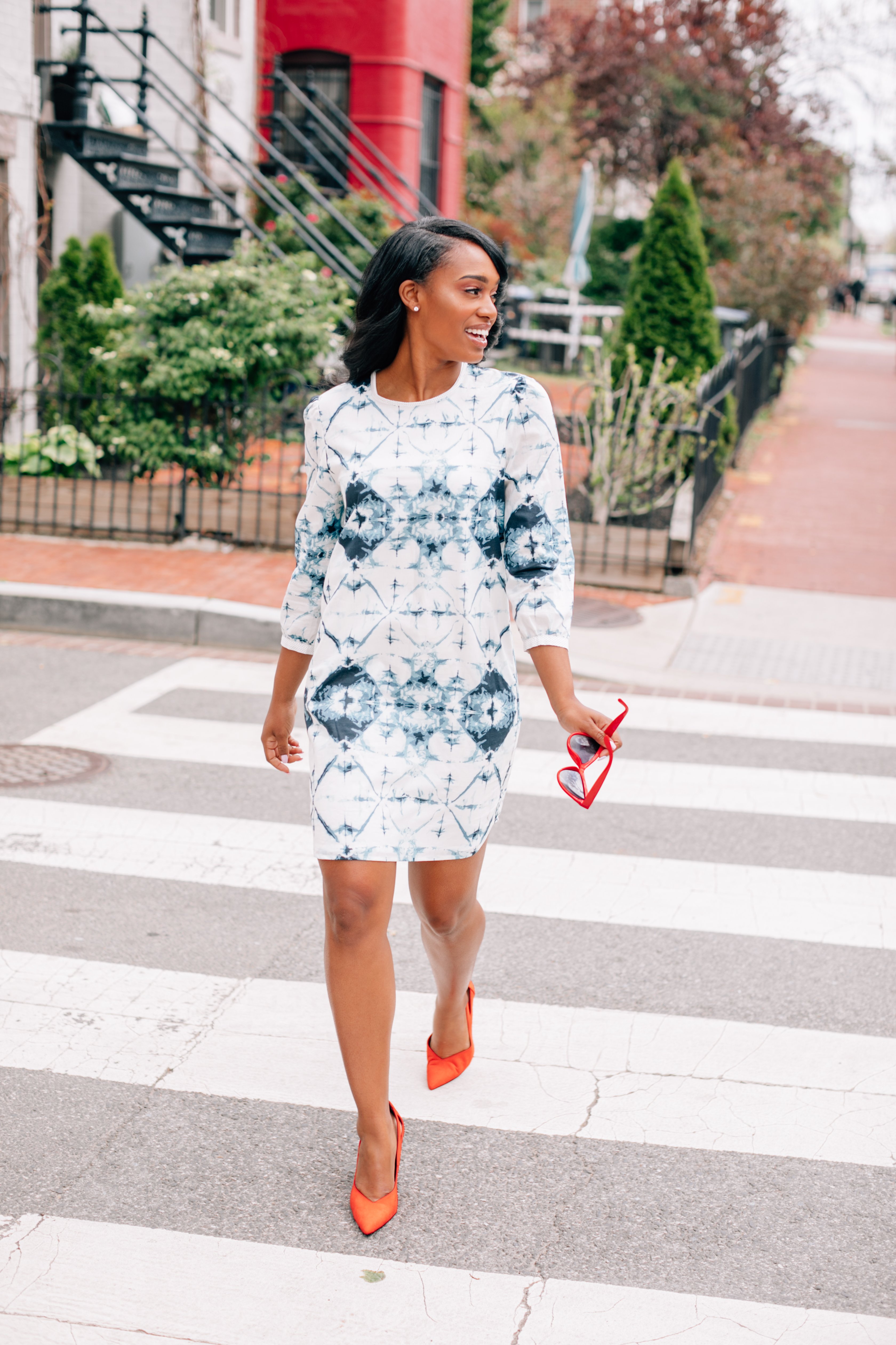 Inkwell Dress featuring bold tie-dye print and polka dot details, 3/4 sleeves, and keyhole back with button closure.