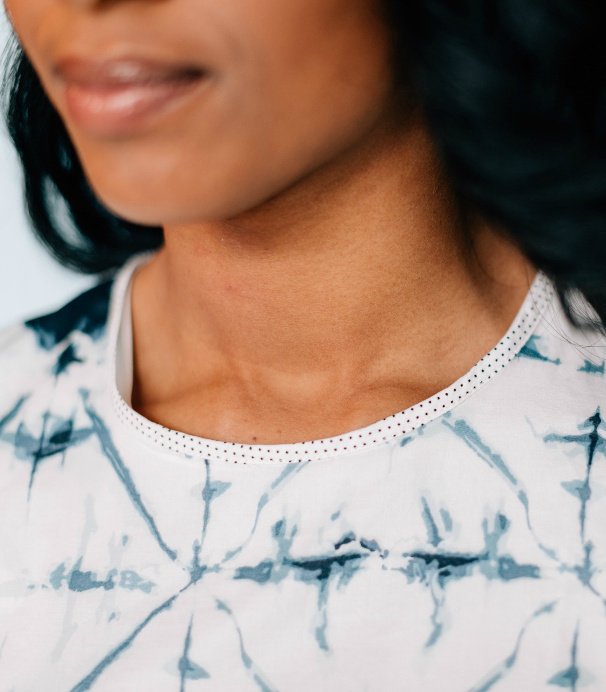 Inkwell Dress featuring bold tie-dye print and polka dot details, 3/4 sleeves, and keyhole back with button closure.