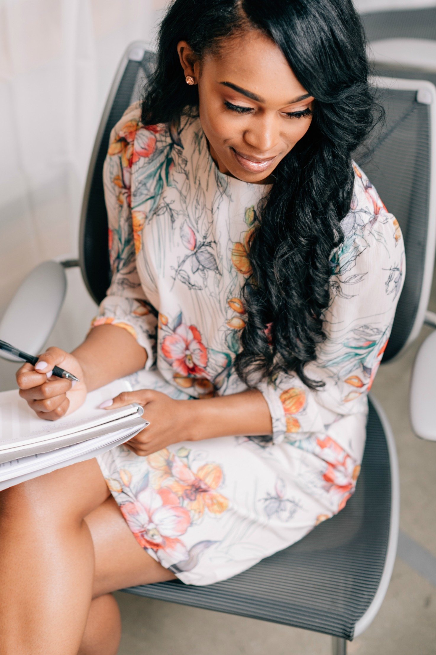 The Juliet Dress featuring a vibrant watercolor pencil print, showcasing its elegant design and keyhole back with button closure.