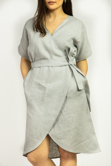 Light Grey linen wrap dress featuring a deep V-neckline, wide sleeves, and side pockets, made from eco-friendly European linen.