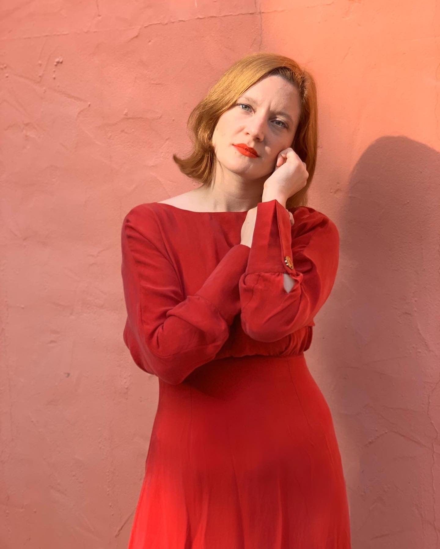 Shay Long Sleeve Midi Dress in red, featuring a backless design and cinched waist, showcasing eco-friendly fabric.