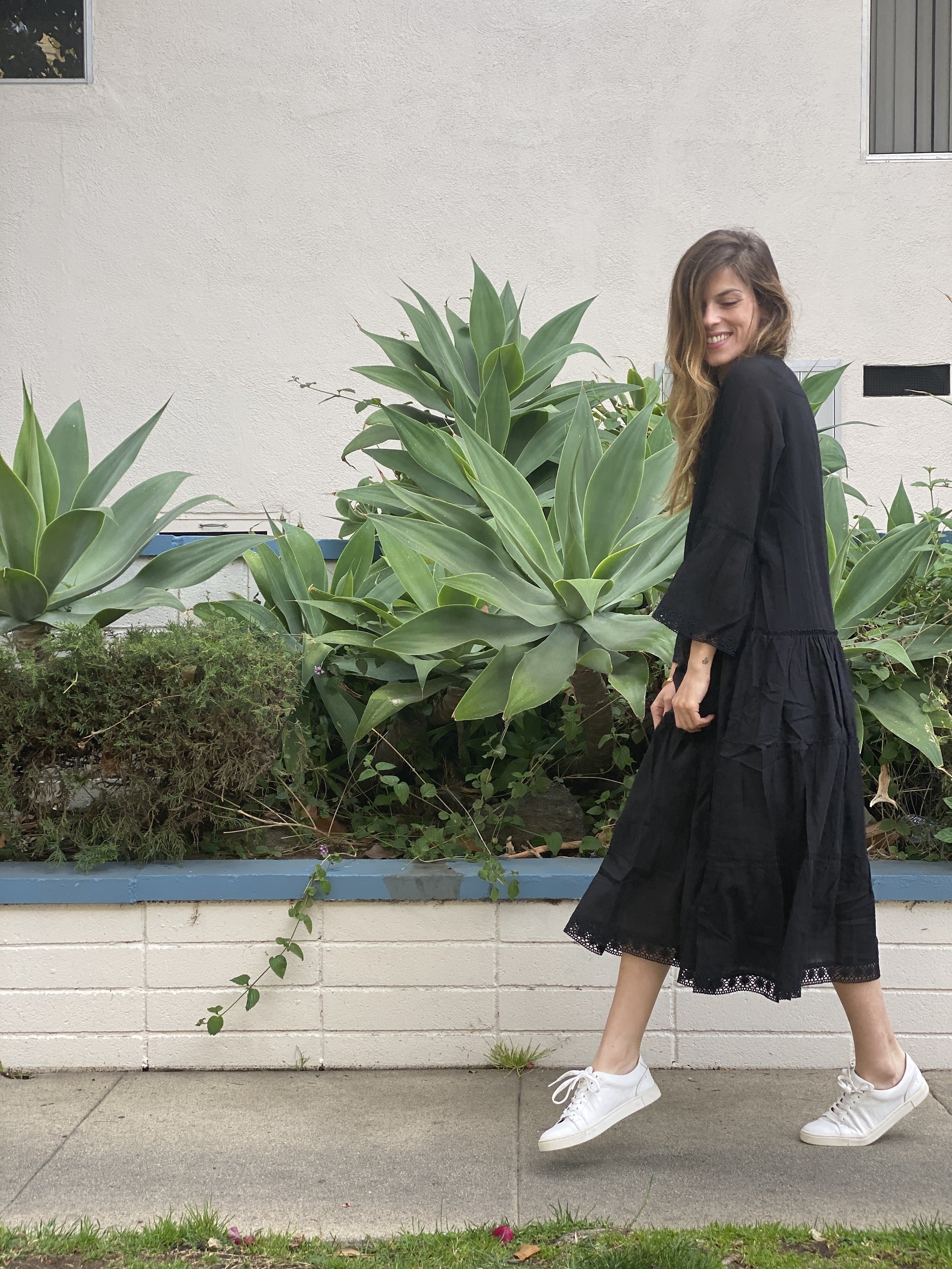 MIKA MAXI DRESS in black featuring a V-neckline, voluminous tiered skirt, and intricate lace edging, perfect for stylish summer outings.