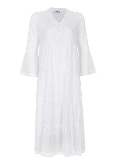 MIKA MAXI DRESS in white featuring a V-neckline and tiered skirt, made from 100% cotton-voile, perfect for warm weather.