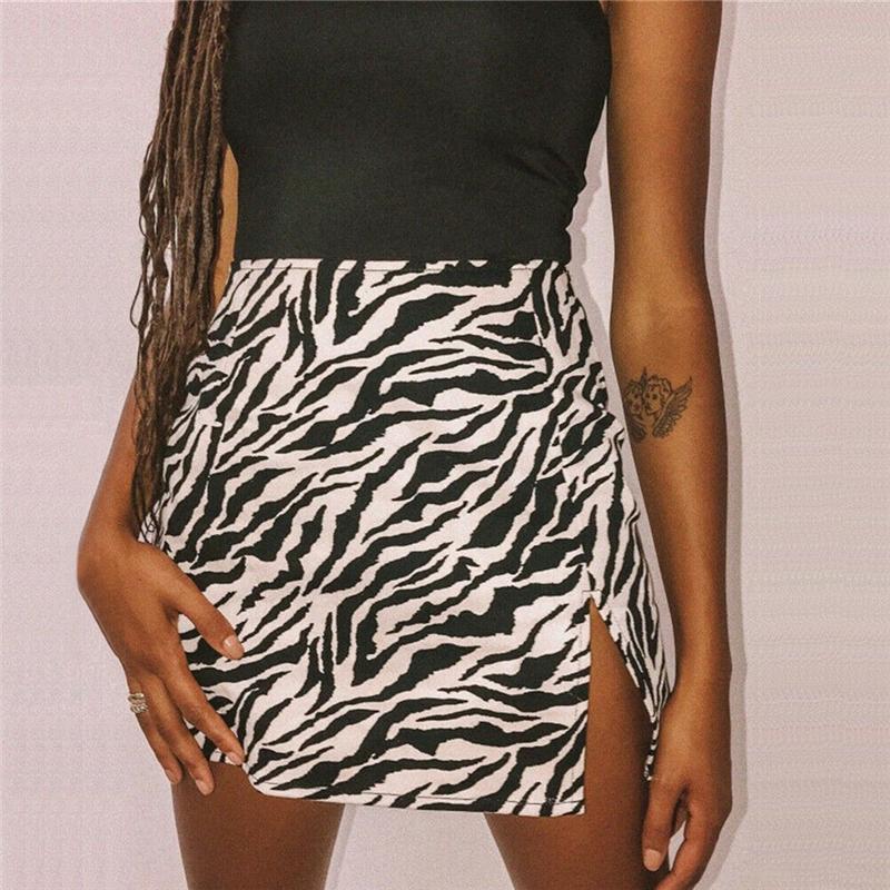 Mini skirt featuring zebra and leopard print design, made from stretchy polyester, perfect for clubbing and casual outings.