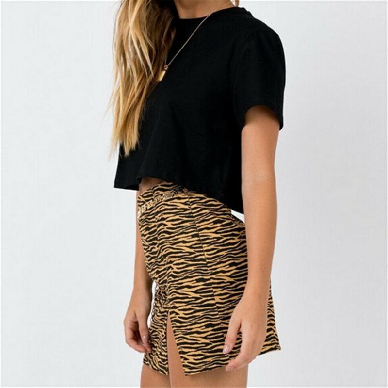 Mini skirt featuring zebra and leopard print design, made from stretchy polyester, perfect for clubbing and casual outings.