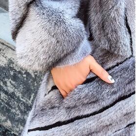 A luxurious natural mink fur coat for women, featuring a thick design, turn-down collar, and pockets, perfect for winter wear.