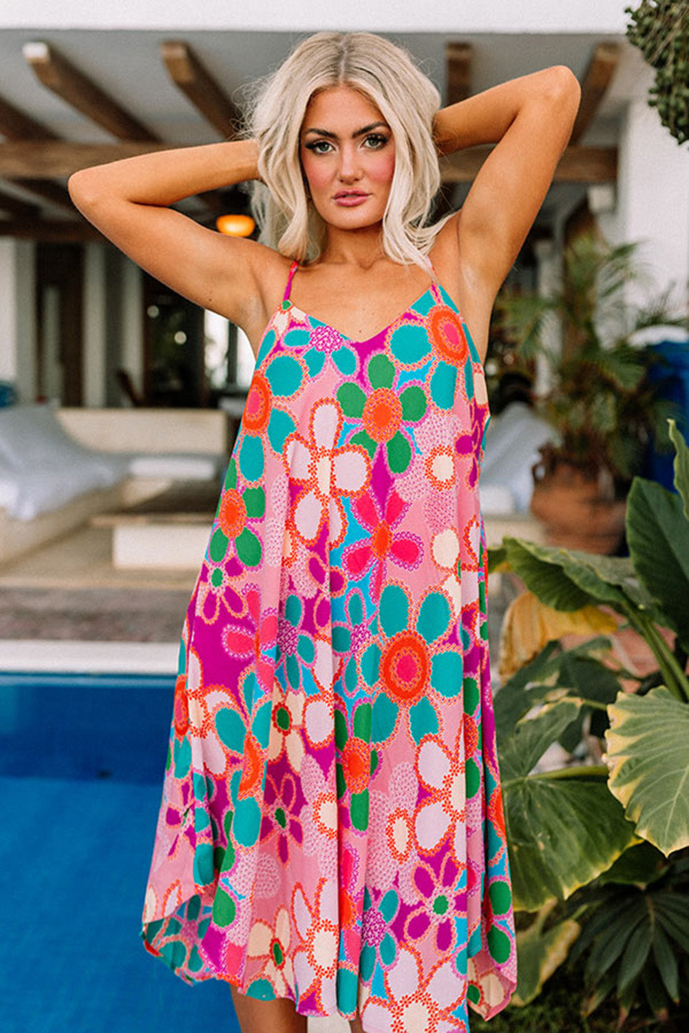 A beautiful New Chic Flowy Midi Dress featuring spaghetti straps and a colorful floral pattern, perfect for summer outings.