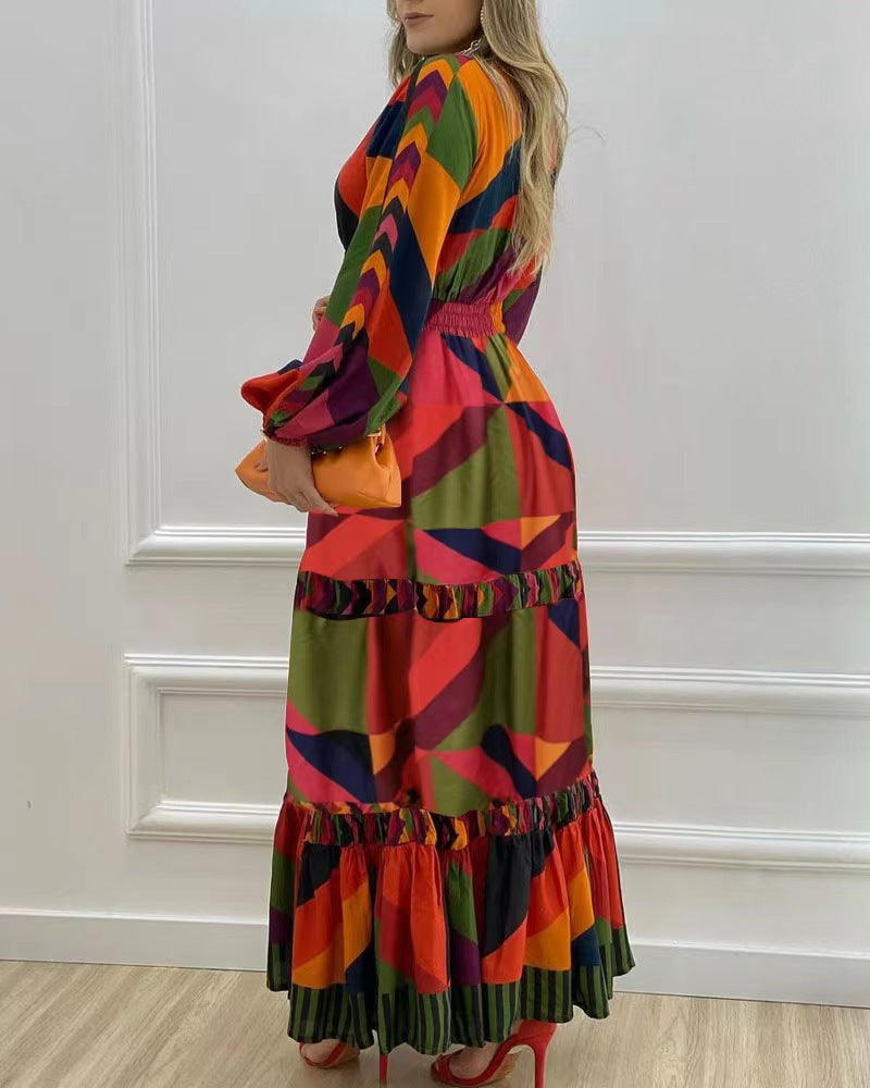 A vibrant long sleeve dress featuring a deep V-neck and colorful print, perfect for various occasions.