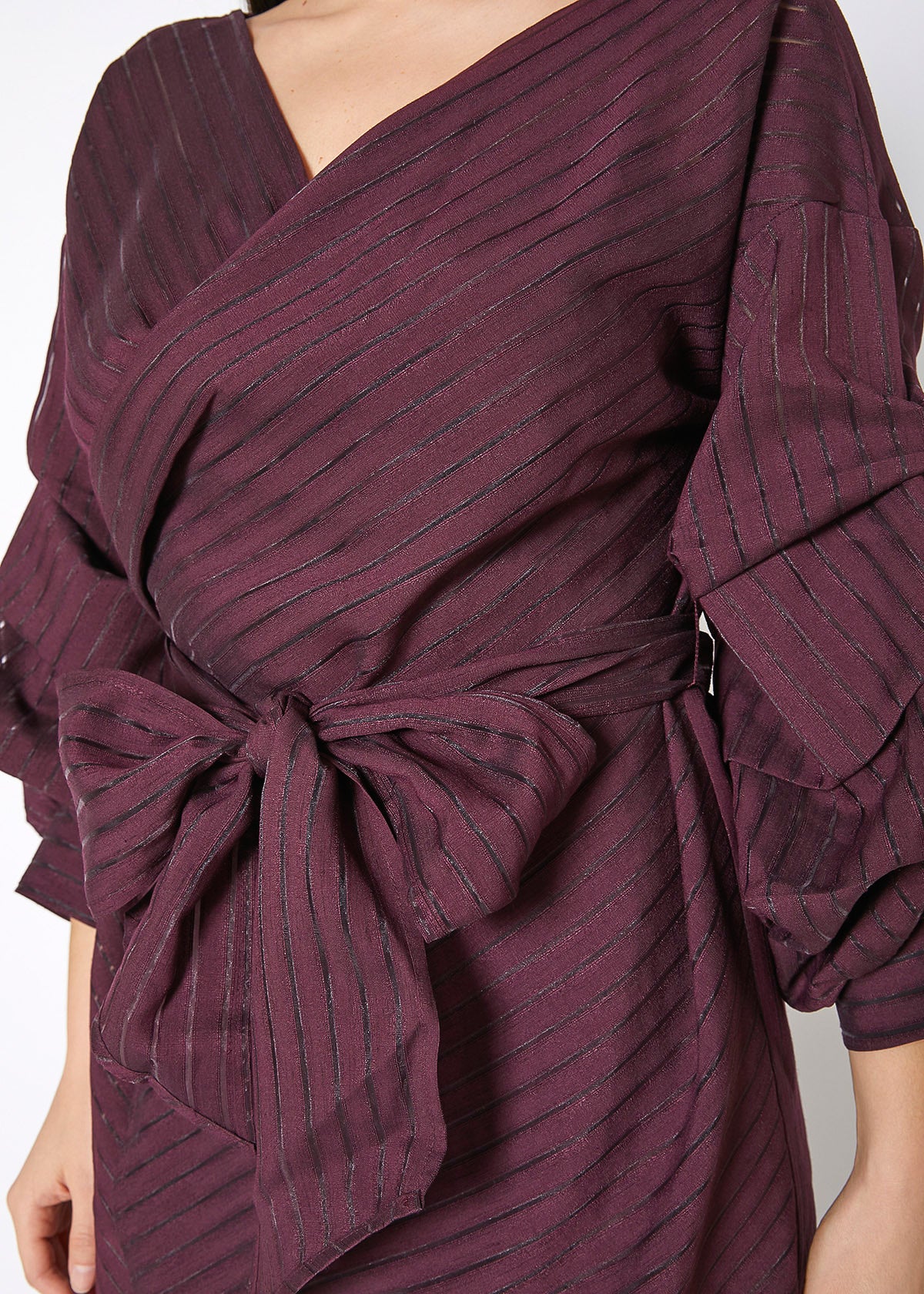 A stylish burgundy organza stripe wrap dress featuring gathered puffy sleeves, perfect for elegant occasions.